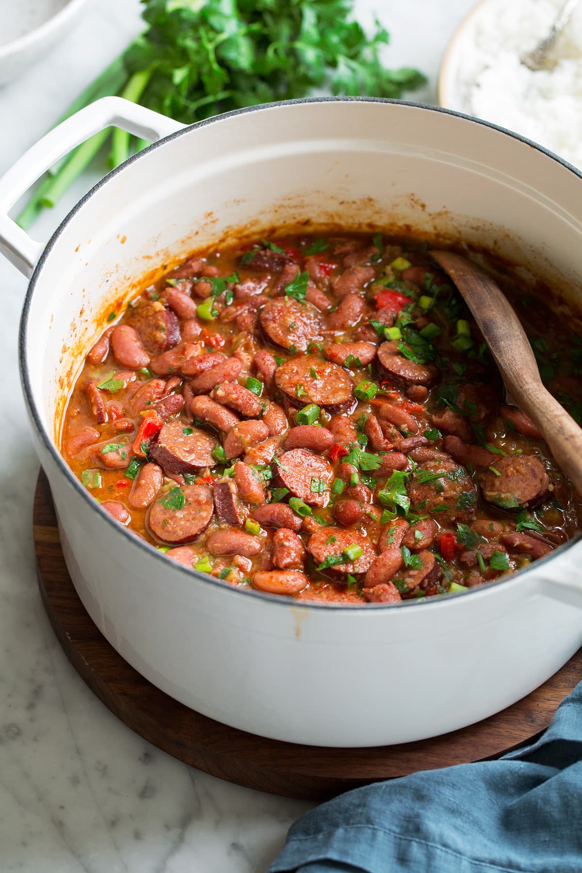 Perfect Red Beans and Rice - delicious Louisiana style comfort food at it's best! #redbeans #rice #southern #recipe #dinner Pot full of red beans and sausage.