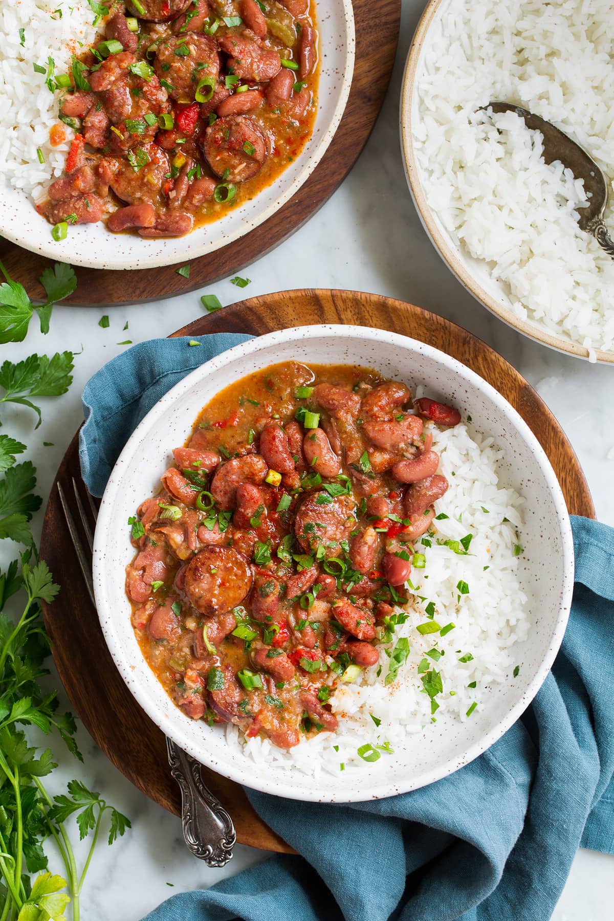 Perfect Red Beans and Rice - delicious Louisiana style comfort food at it's best! #redbeans #rice #southern #recipe #dinner two servings of red beans and rice in bowls