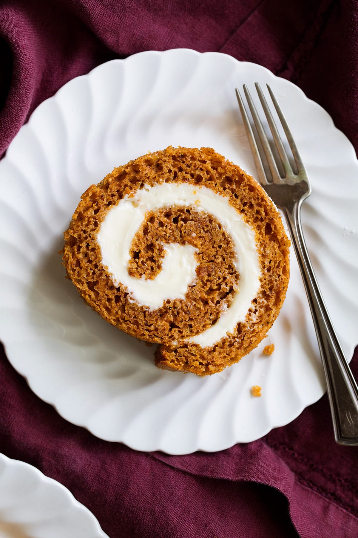 Pumpkin Roll Close up image of one slice of pumpkin roll cake.