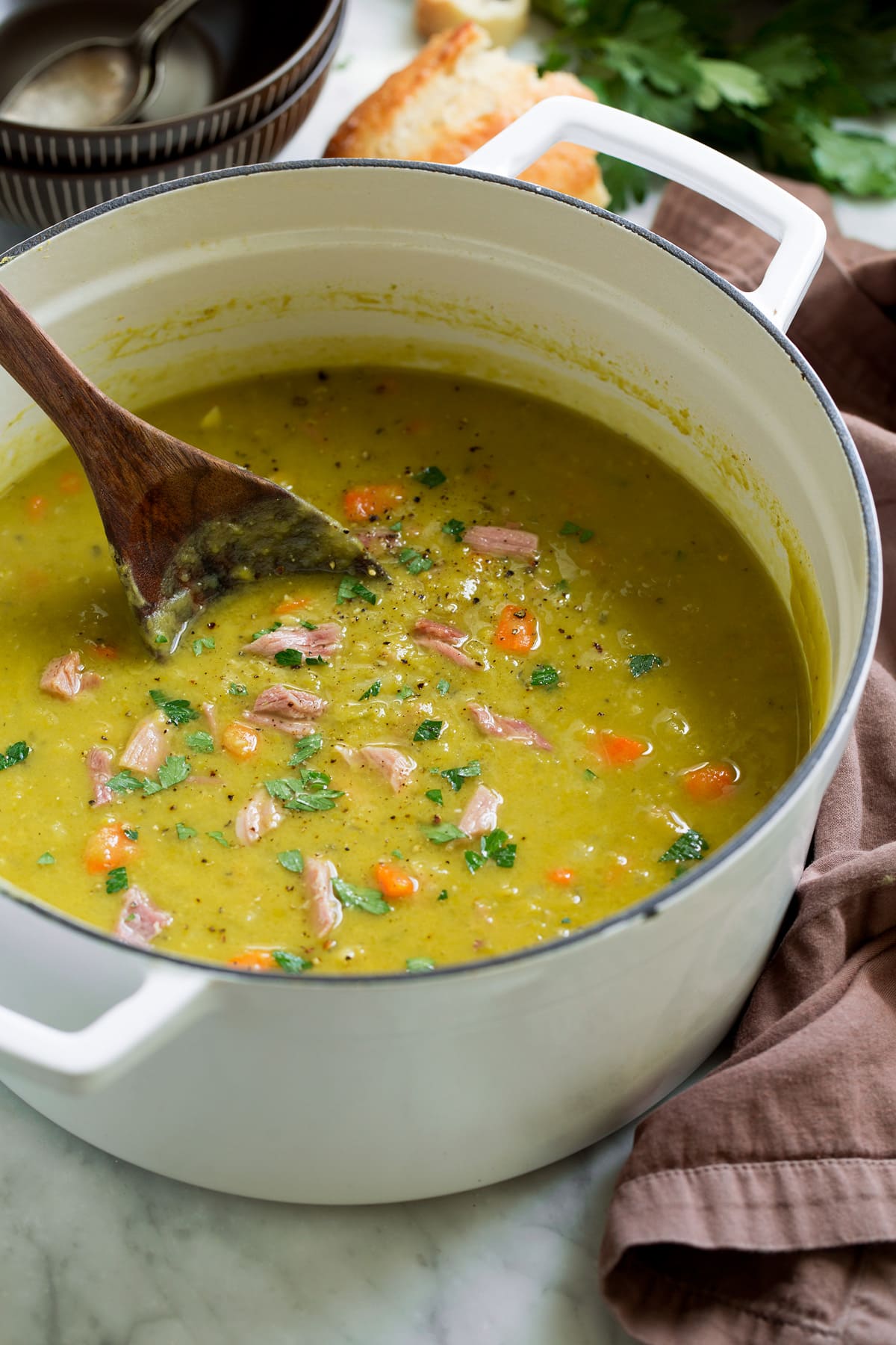 Split Pea Soup - such a delicious and comforting soup. This made from scratch version is a hundred times better than what you get in the can and it's so easy to make! #splitpea #soup #recipe Pot of homemade split pea soup.
