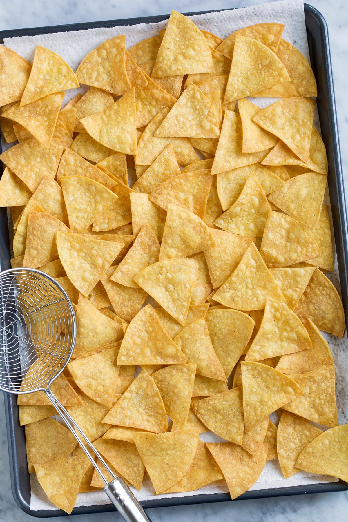 Homemade Tortilla Chips Pan full of homemade tortilla chips.