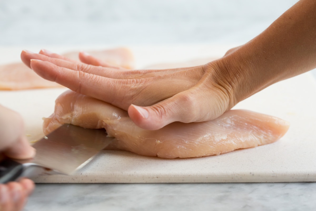 Chicken Piccata Showing how to slice a chicken breast in half to create two cutlets.