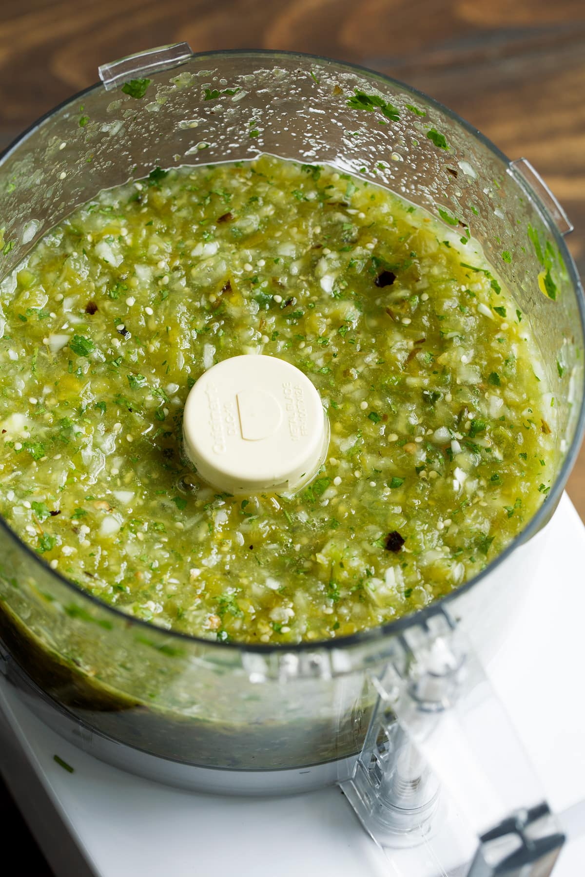 Salsa Verde Chopped up salsa verde in a food processor.