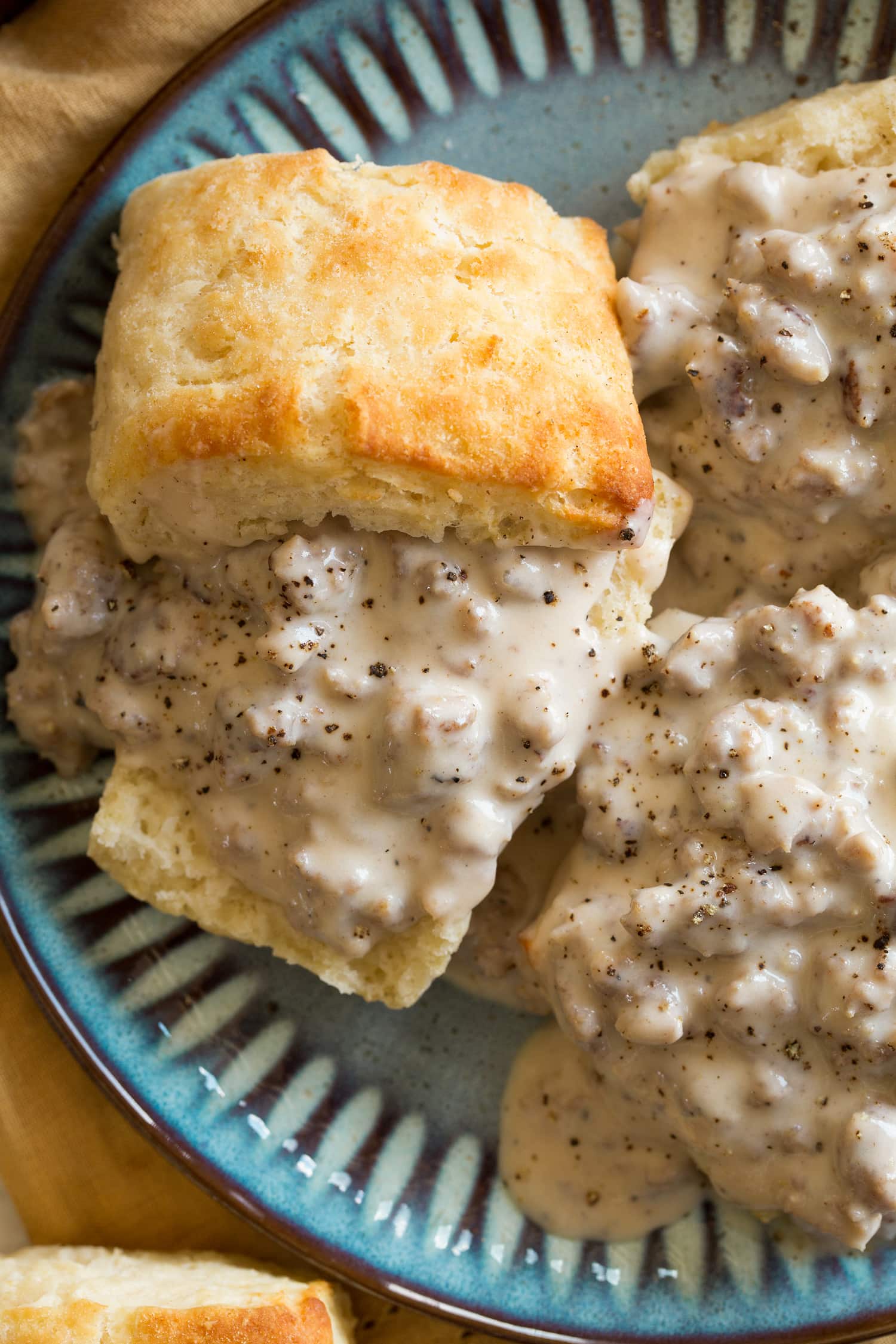 Biscuits and Sausage Gravy Close up photo overhead of biscuits and gravy.