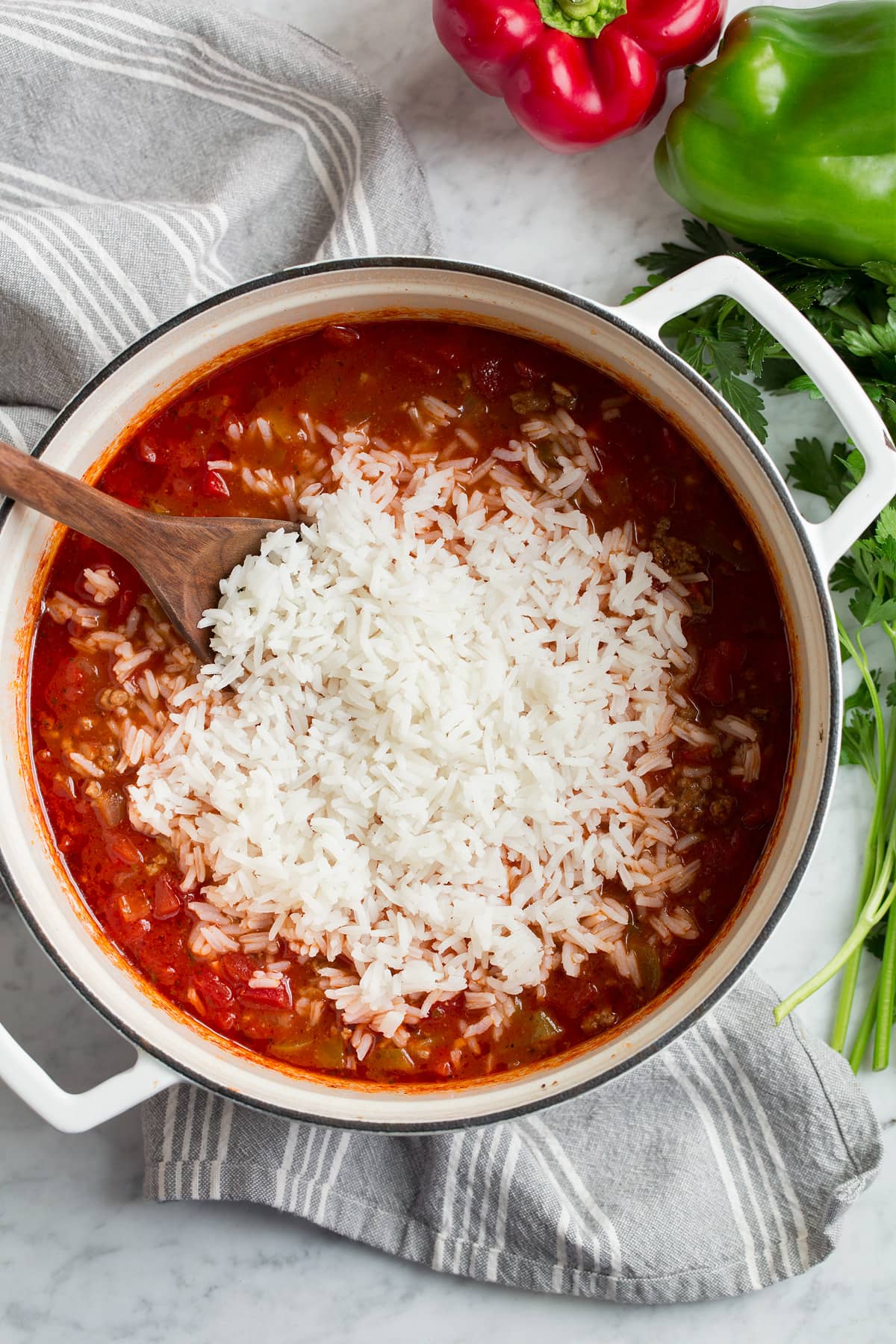 Stuffed Pepper Soup Stirring rice into stuffed pepper soup.
