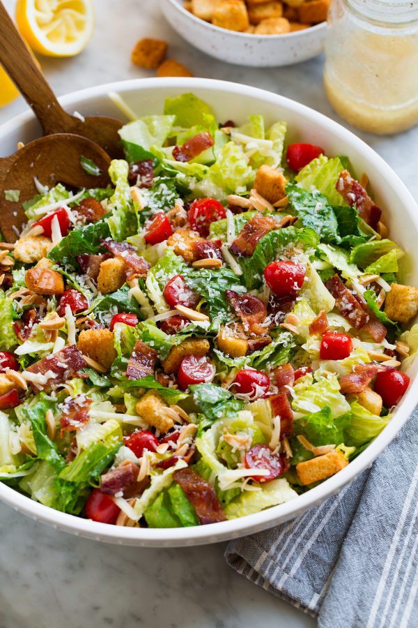 Salad in a large white serving bowl.