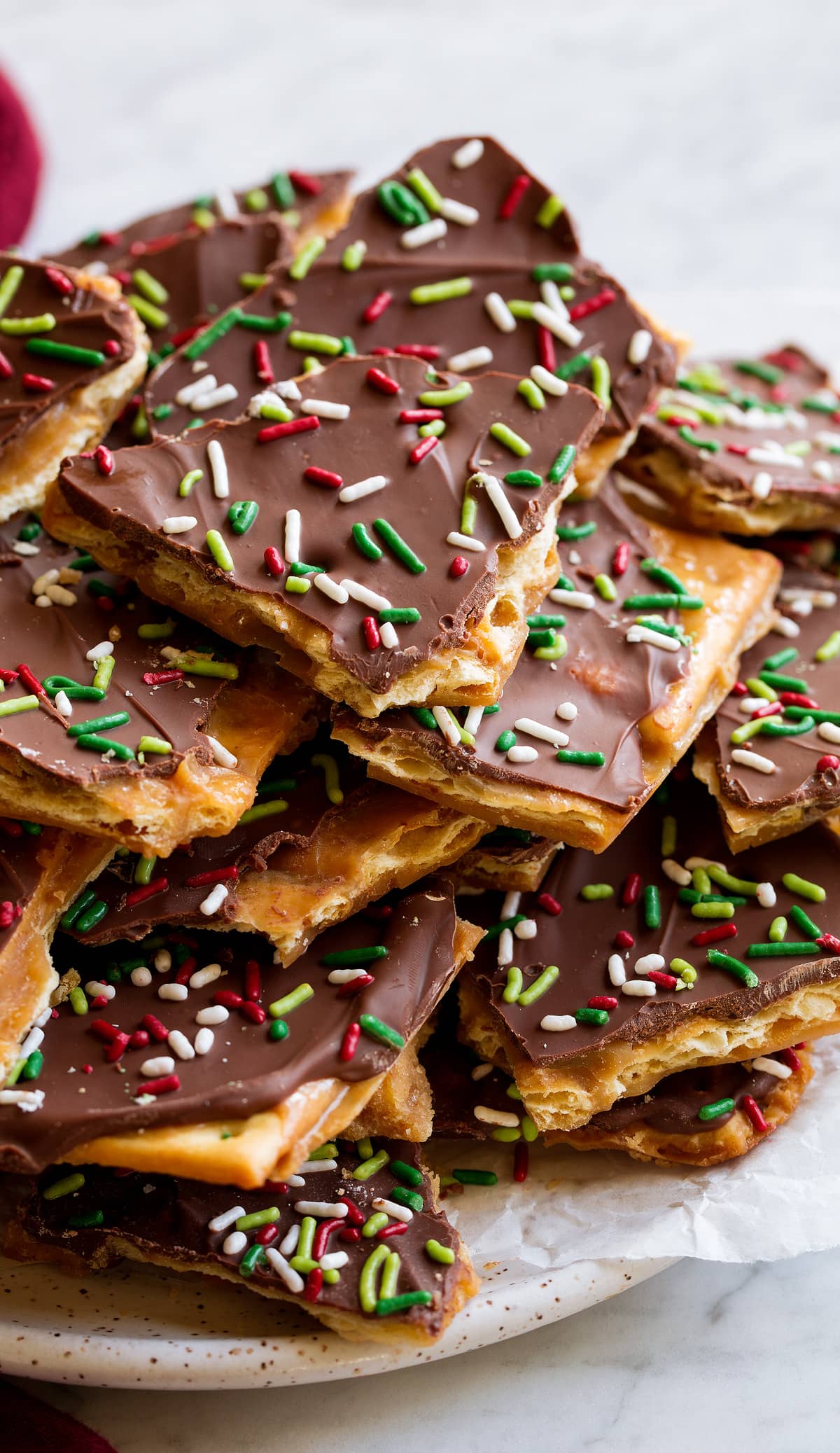 Christmas Crack Close up image of Christmas Crack covered with chocolate and sprinkles.