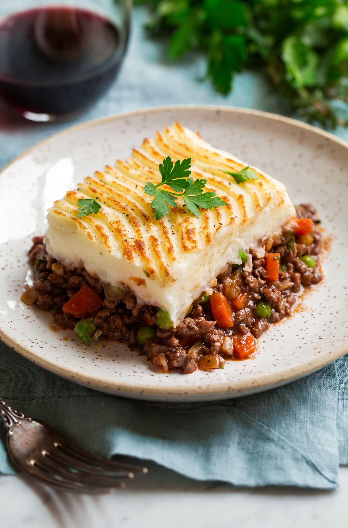 Shepherd's Pie Cut serving of shepherd's pie on a serving plate.
