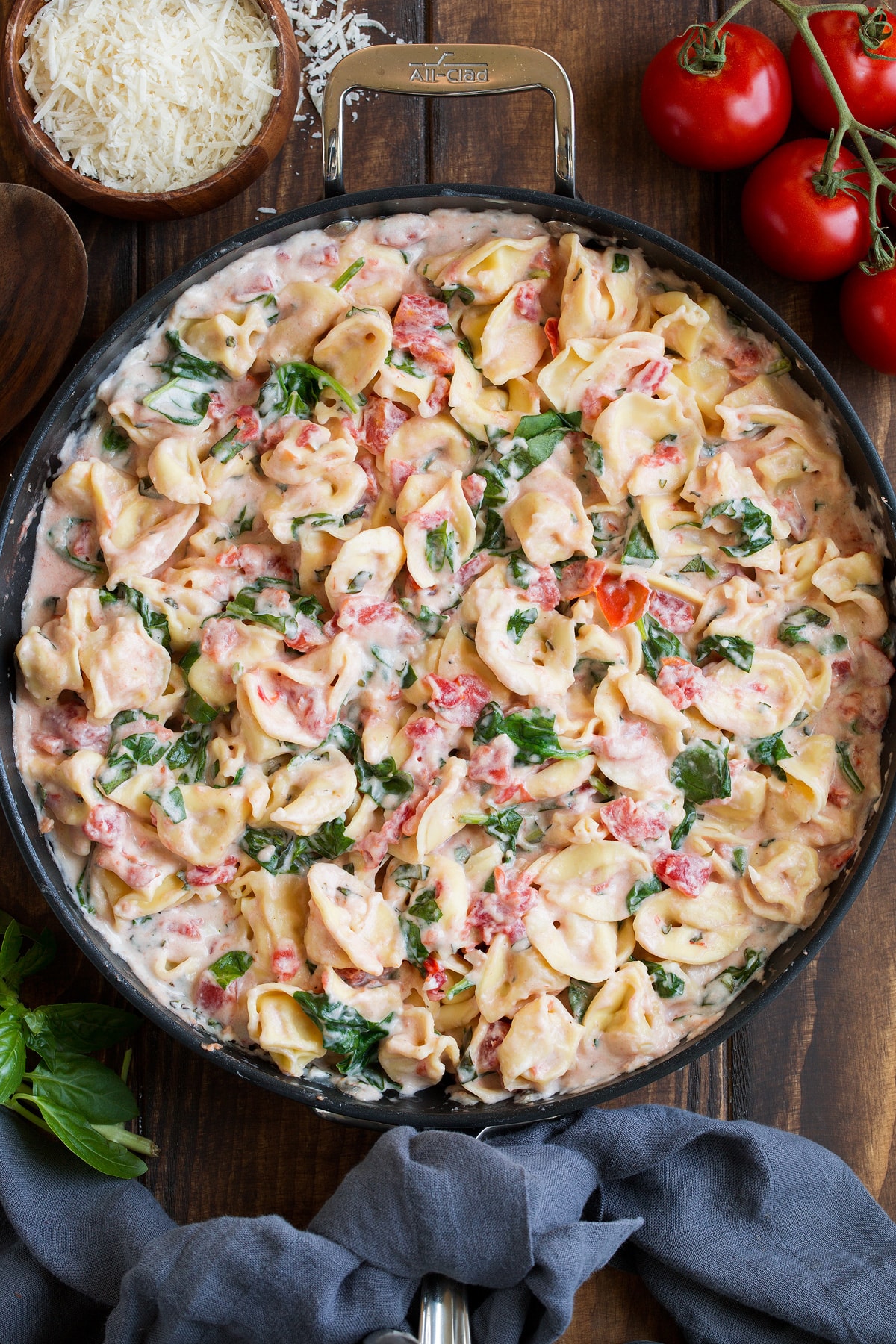 Creamy Spinach Tomato Tortellini Creamy Spinach Tomato Tortellini shown in a large skillet.