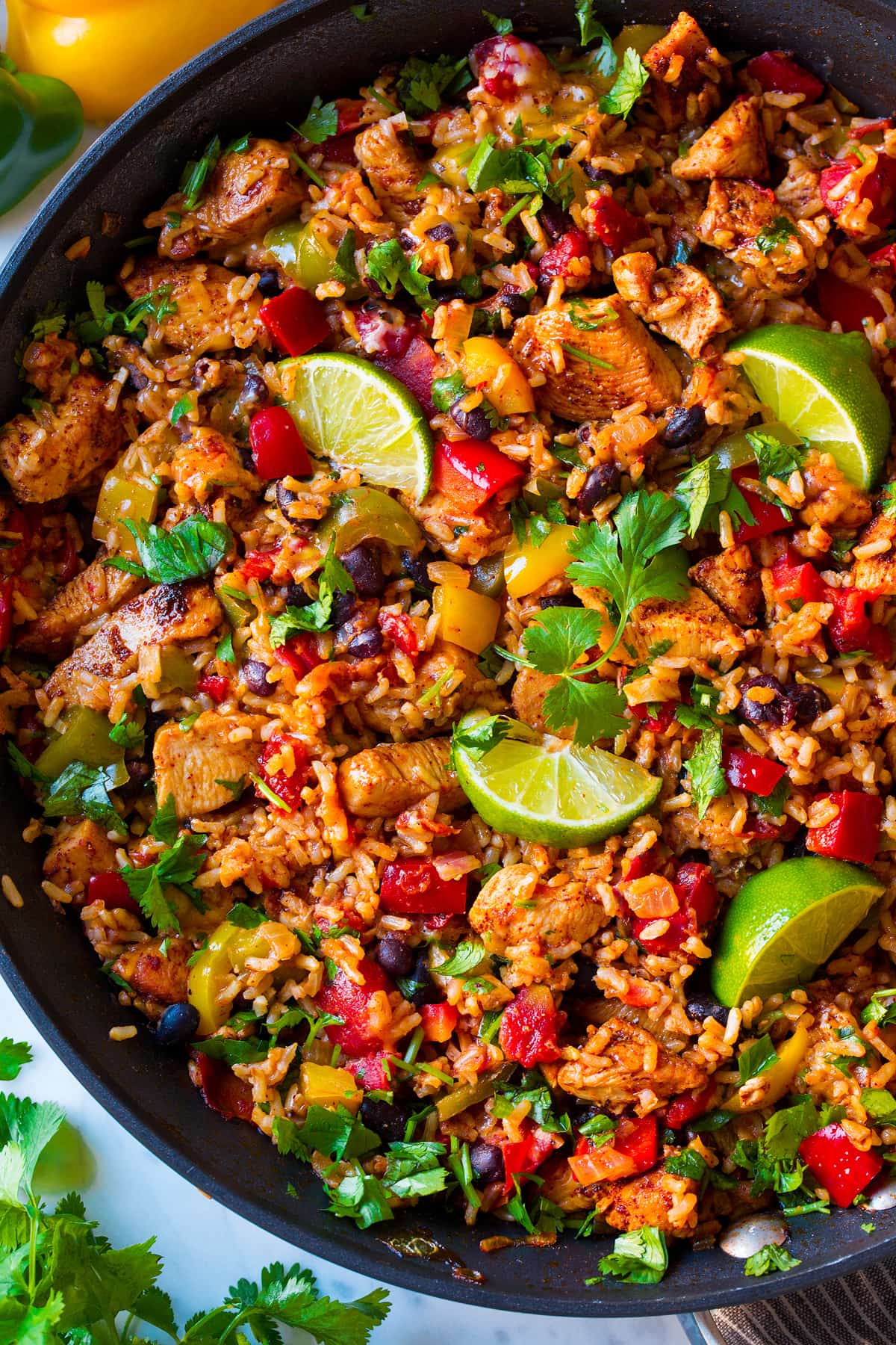 Chicken Fajita Rice Bowls Close up image of chicken rice bowl in a pan.