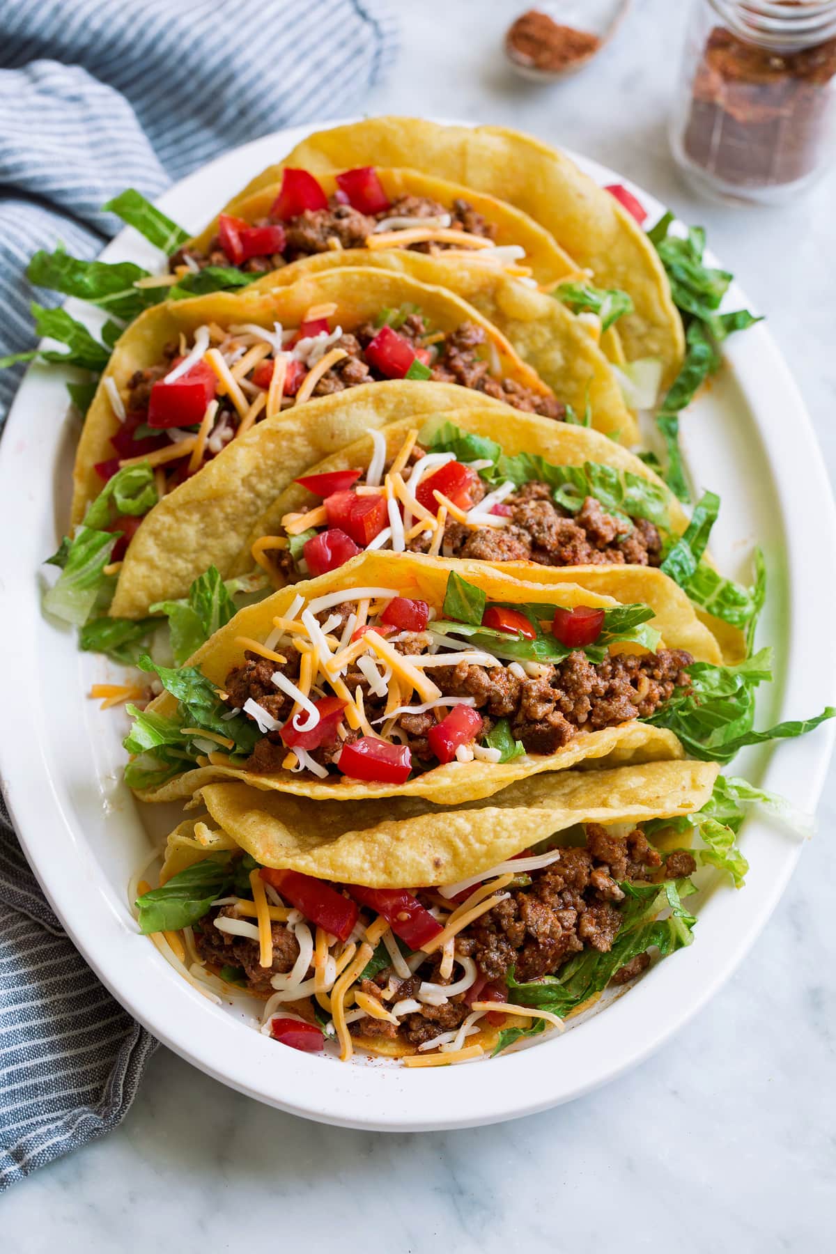 Homemade Taco Seasoning Photo of ground beef tacos on a platter which have been seasoned with a homemade taco seasoning. Showing how to use the DIY taco seasoning.