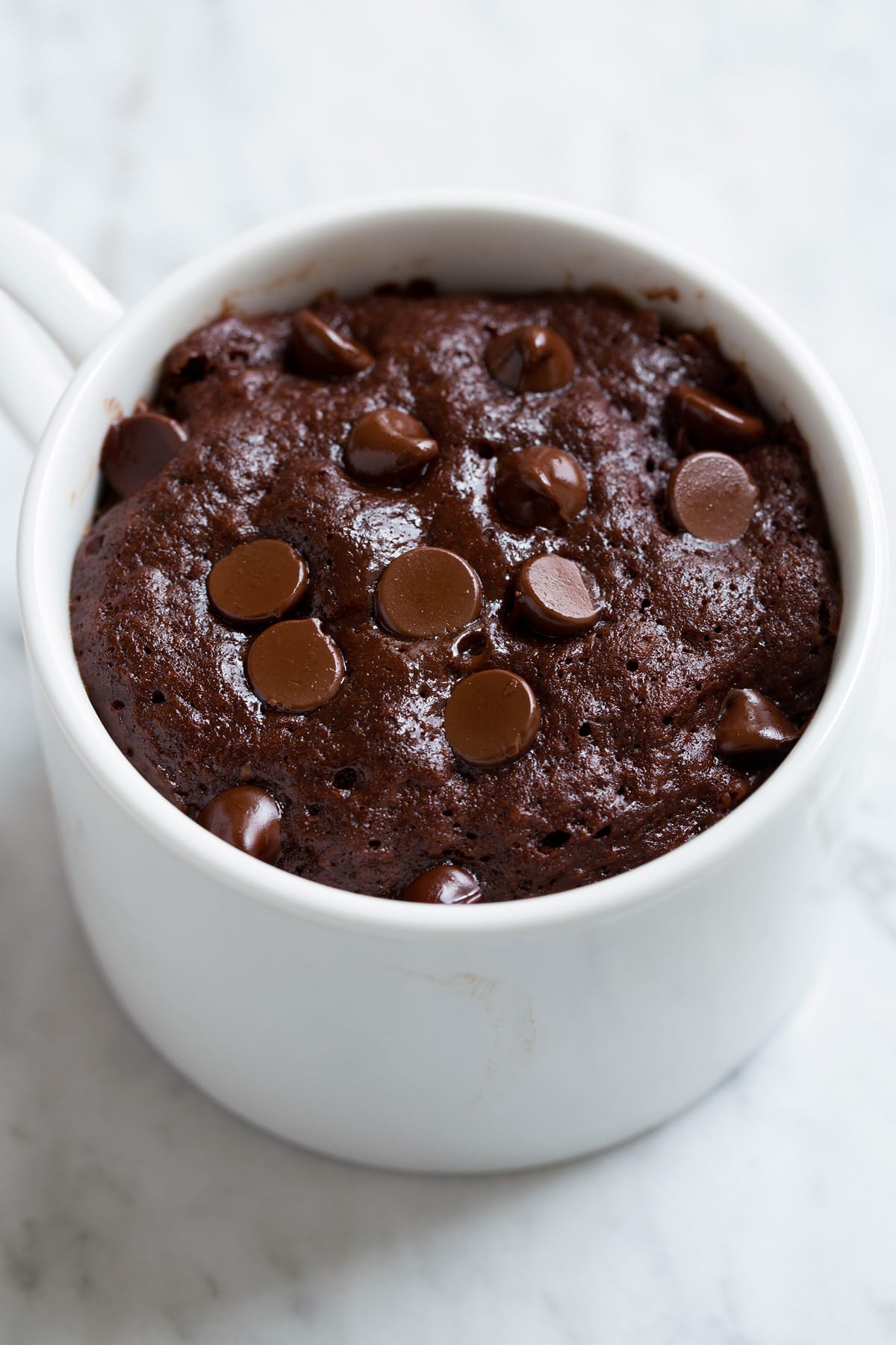 Chocolate Mug Cake Chocolate Mug Cake shown just after cooking in the microwave.