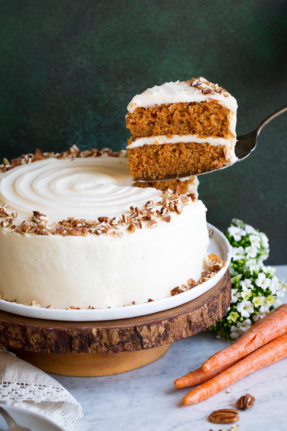 Carrot Cake Carrot Cake with one slice being removed.
