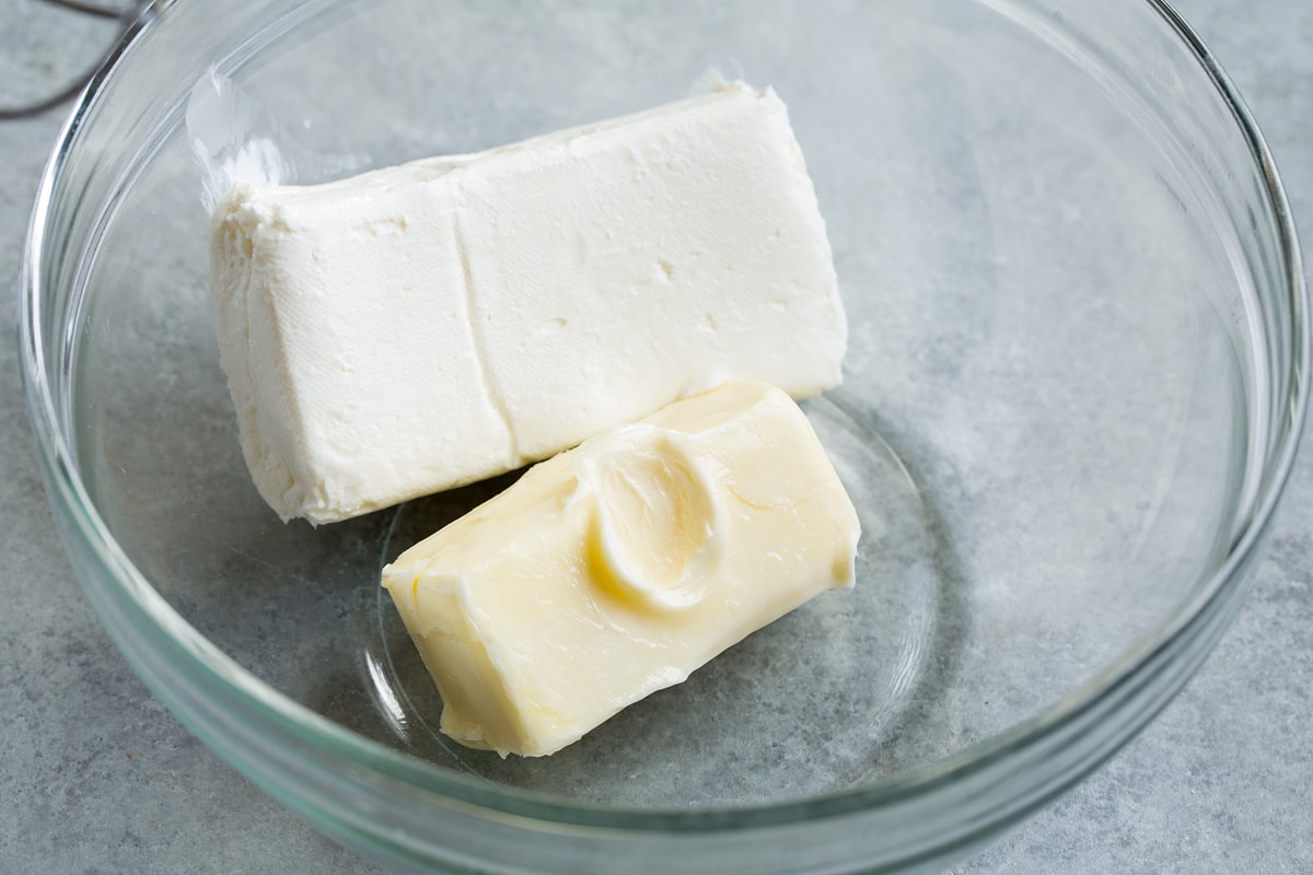 Red Velvet Cake Block of cream cheese and butter in a glass mixing bowl.