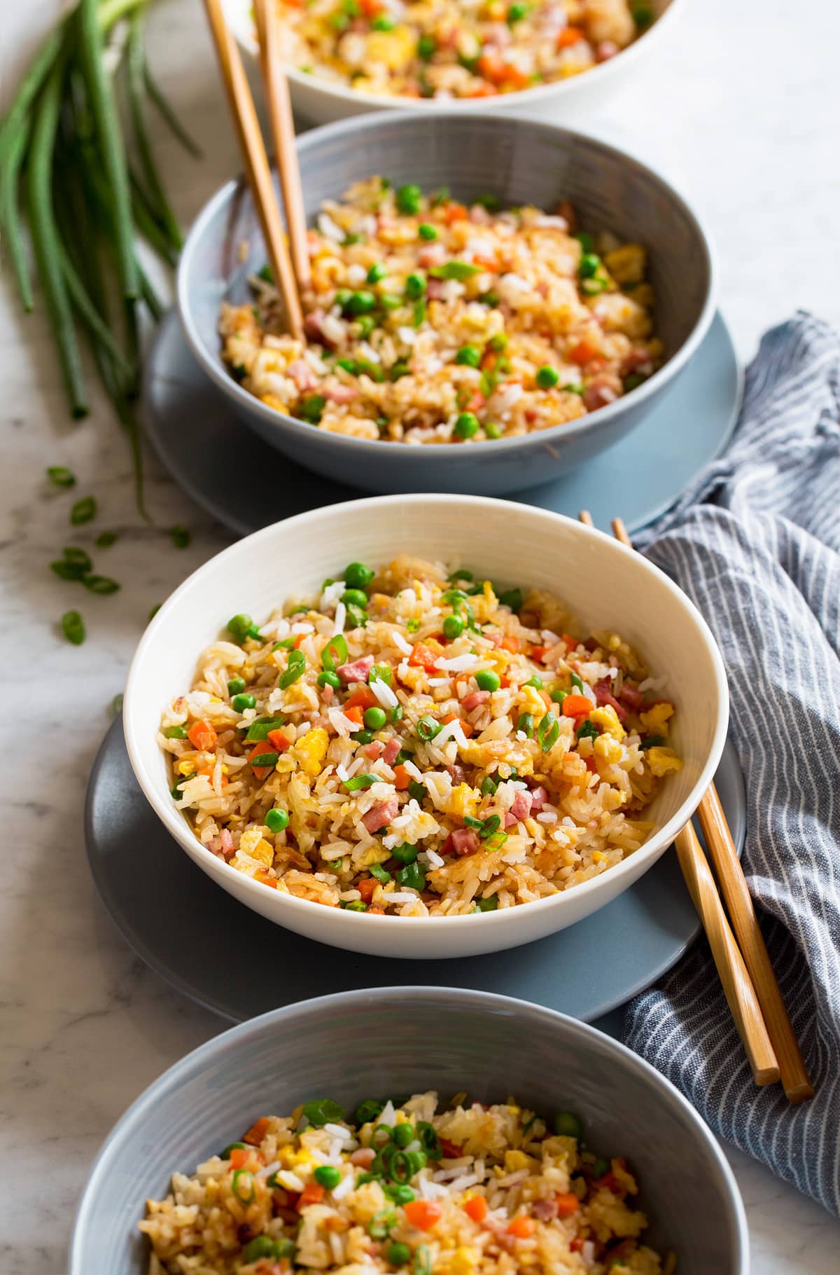 Fried Rice Fried rice shown in four bowls in a row.