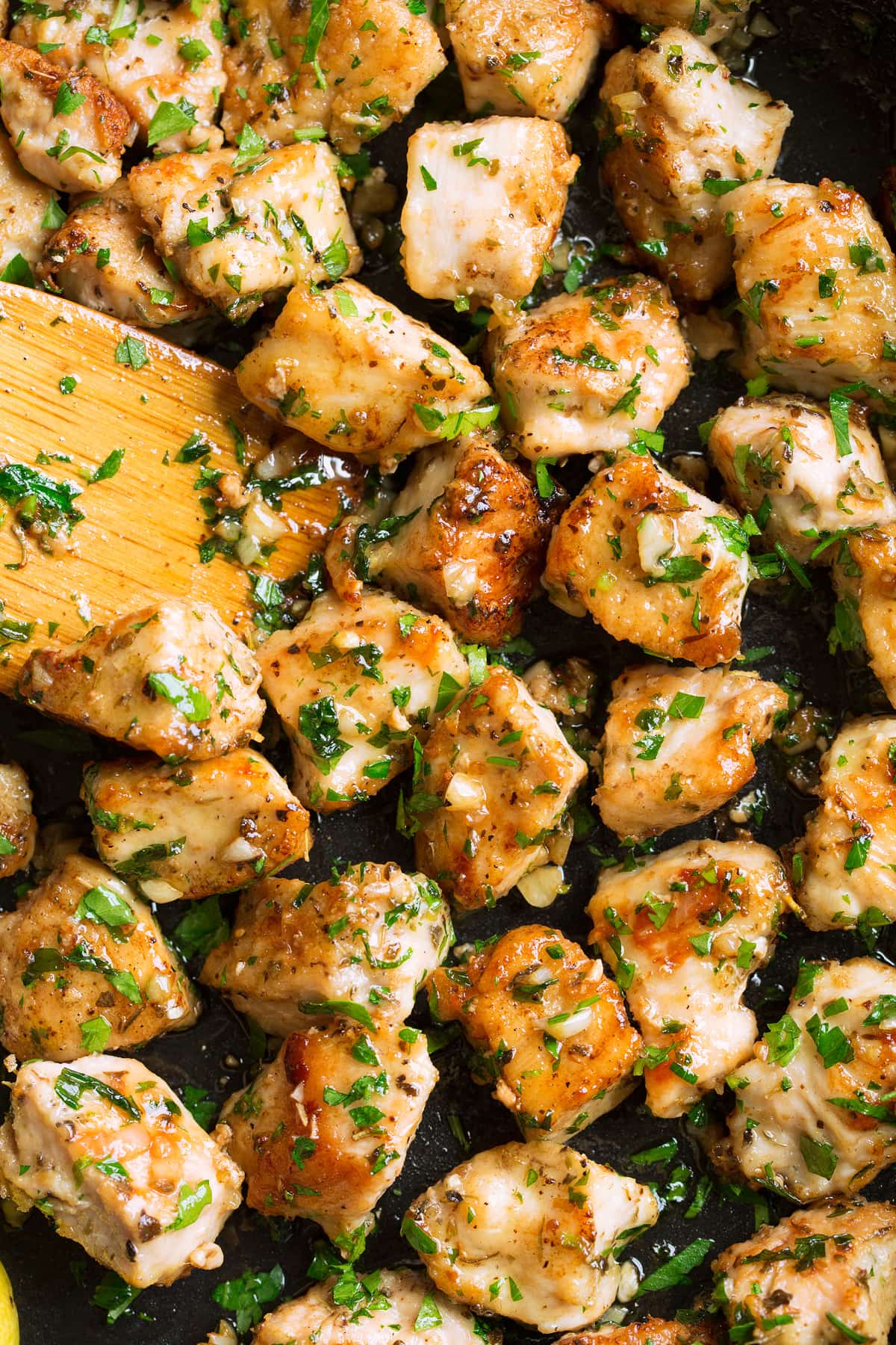 Garlic Butter Chicken Bites Close up image of garlic butter chicken bites in a skillet.