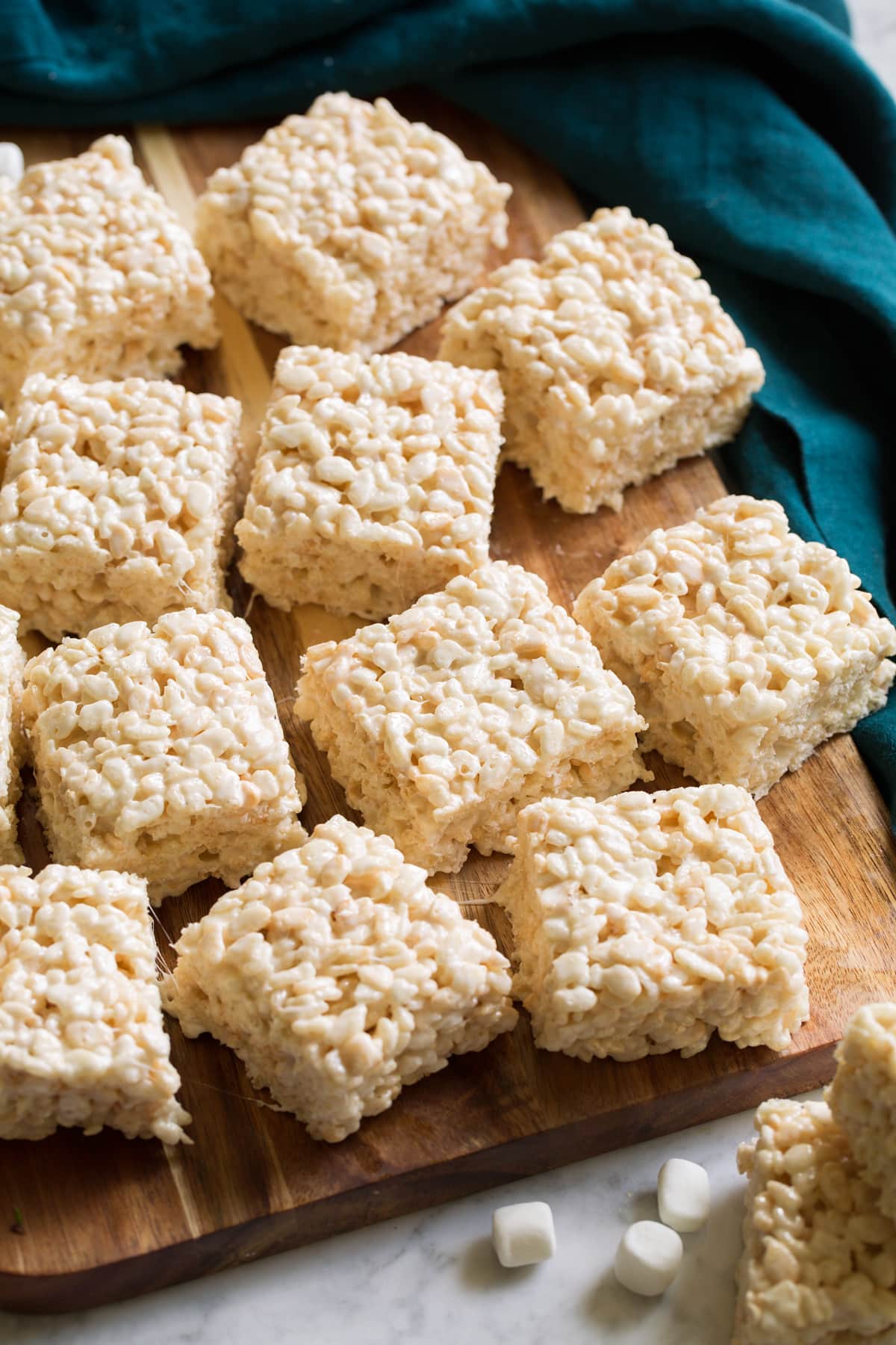 Rice Krispie Treats Rice krispie treats on a cutting boards.