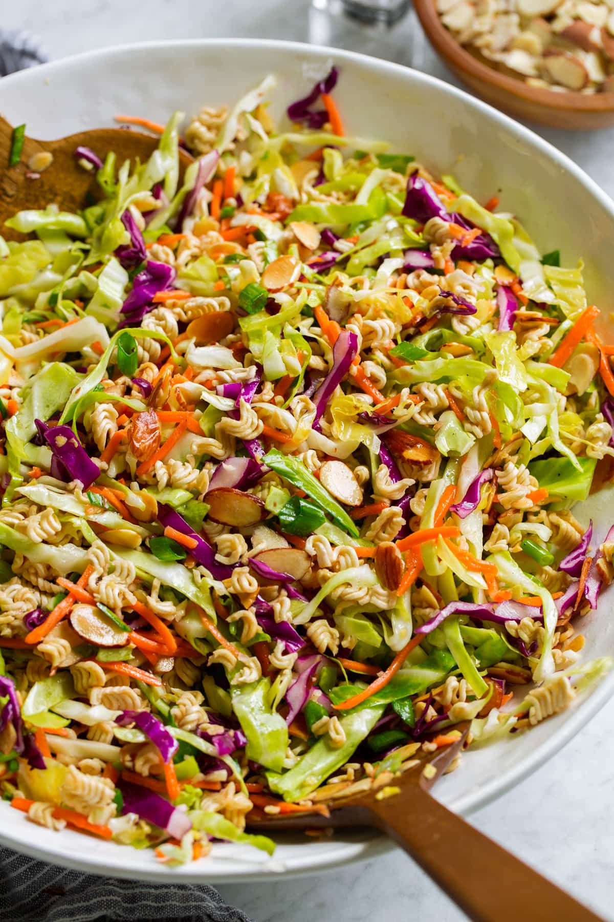 Ramen Noodle Salad Ramen noodle salad in a serving bowl shown from a side angle.