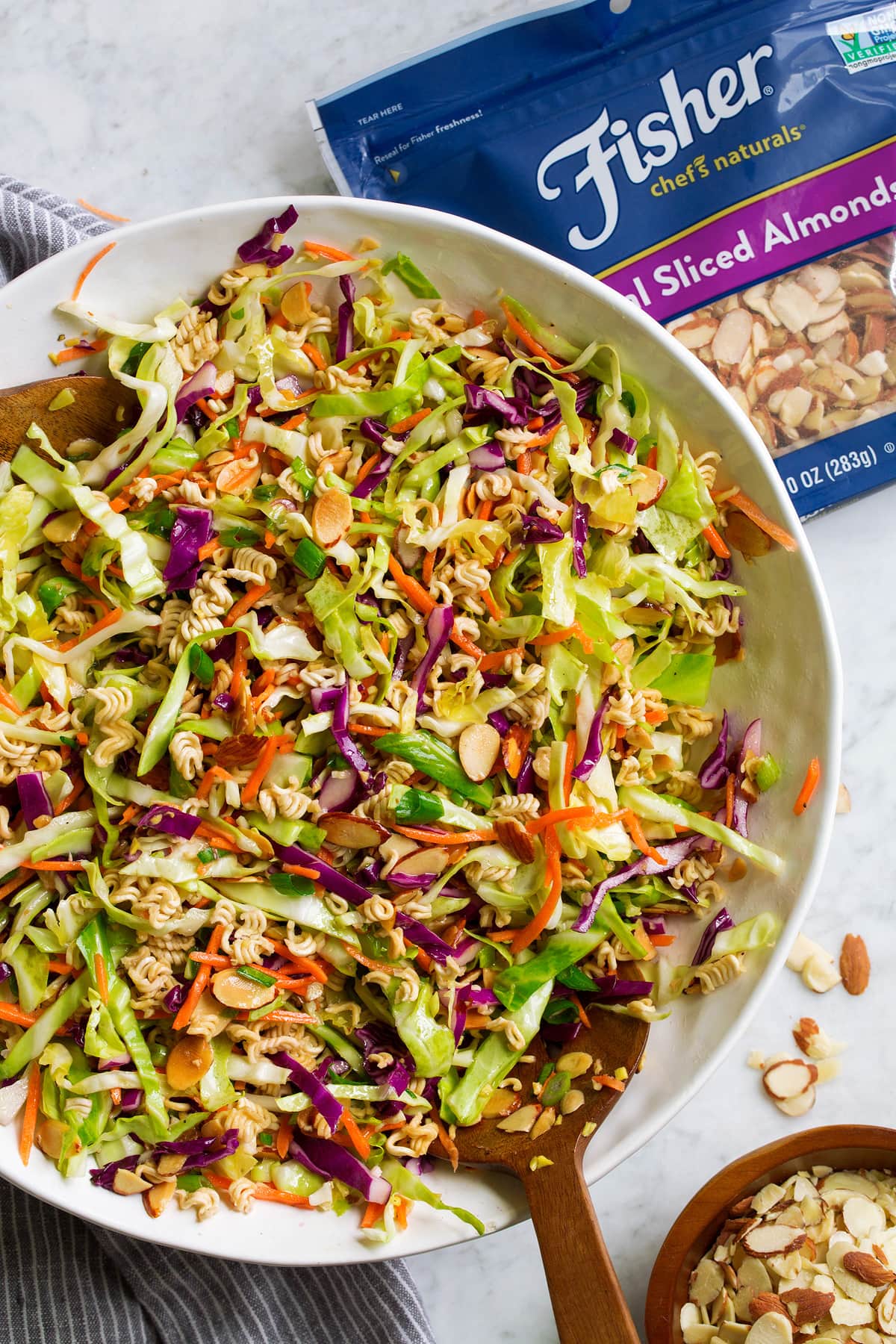 Ramen Noodle Salad Overhead image of ramen noodle salad tossed together in a large white bowl.
