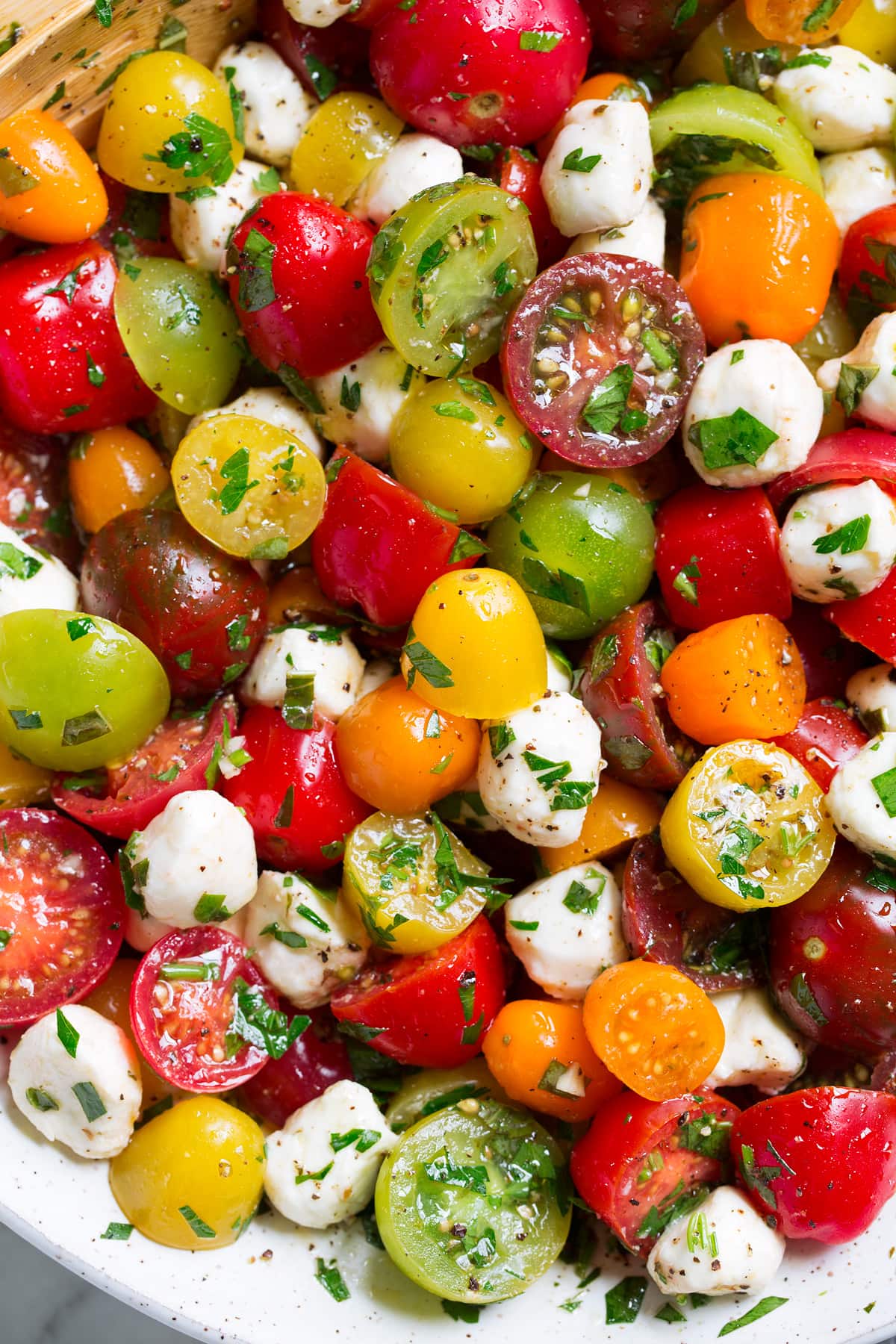 Tomato Salad Close up image of tomato salad in a ceramic bowl.