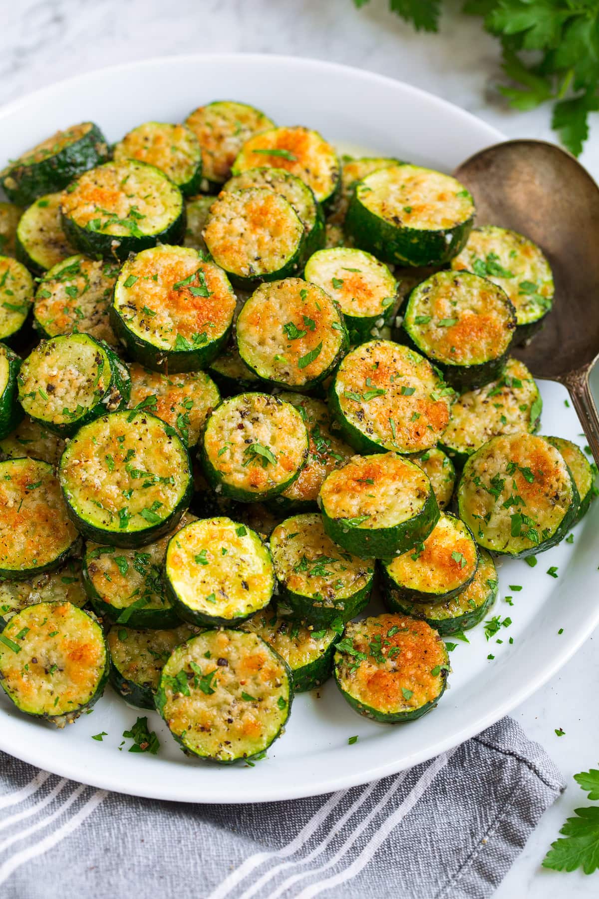 Baked zucchini shown sliced, from a side angle.