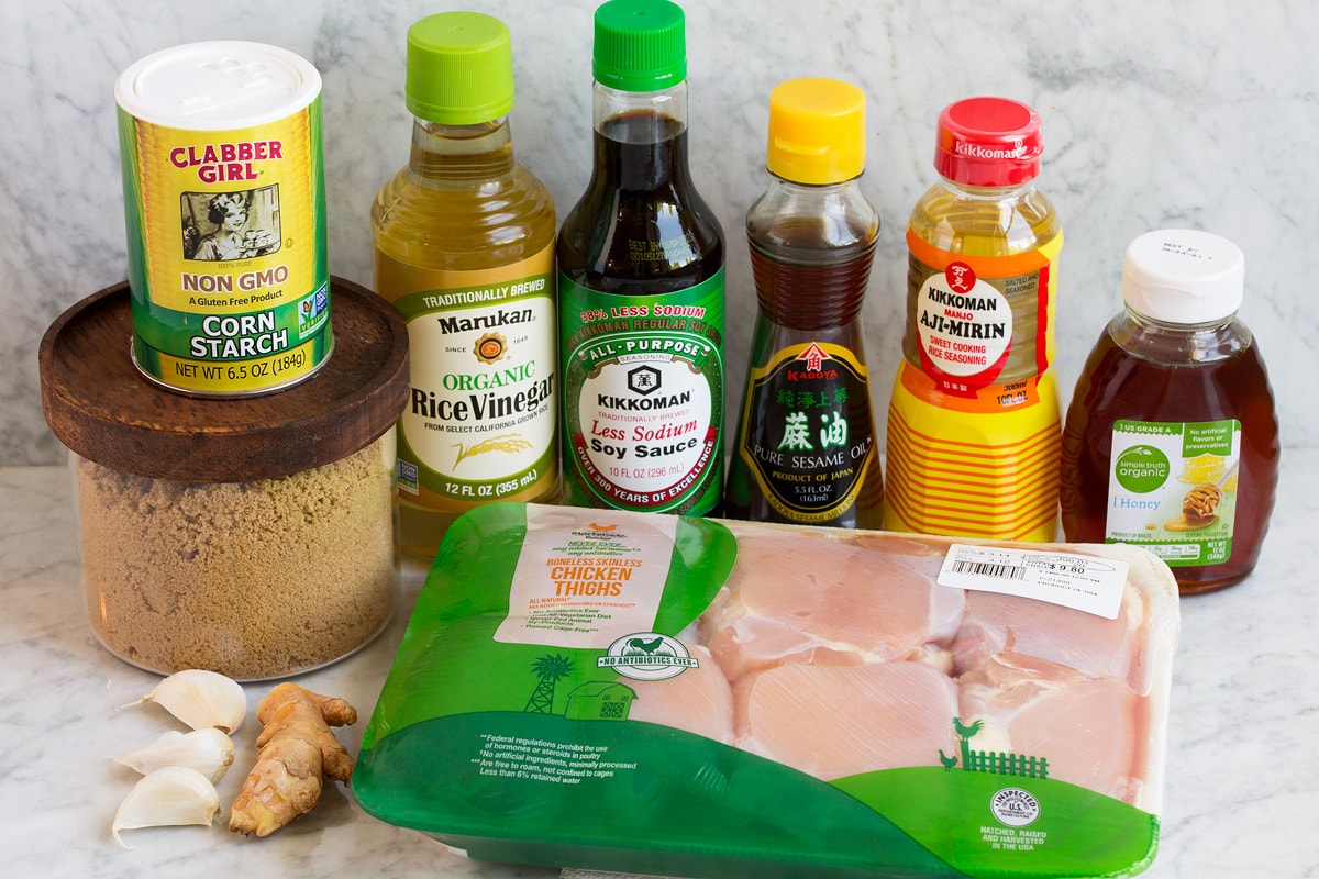 Marinated Grilled Teriyaki Chicken Image of ingredients used to make teriyaki chicken marinade. Includes soy sauce, rice vinegar, mirin, sesame oil, brown sugar, honey, ginger, garlic, chicken thighs and cornstarch.