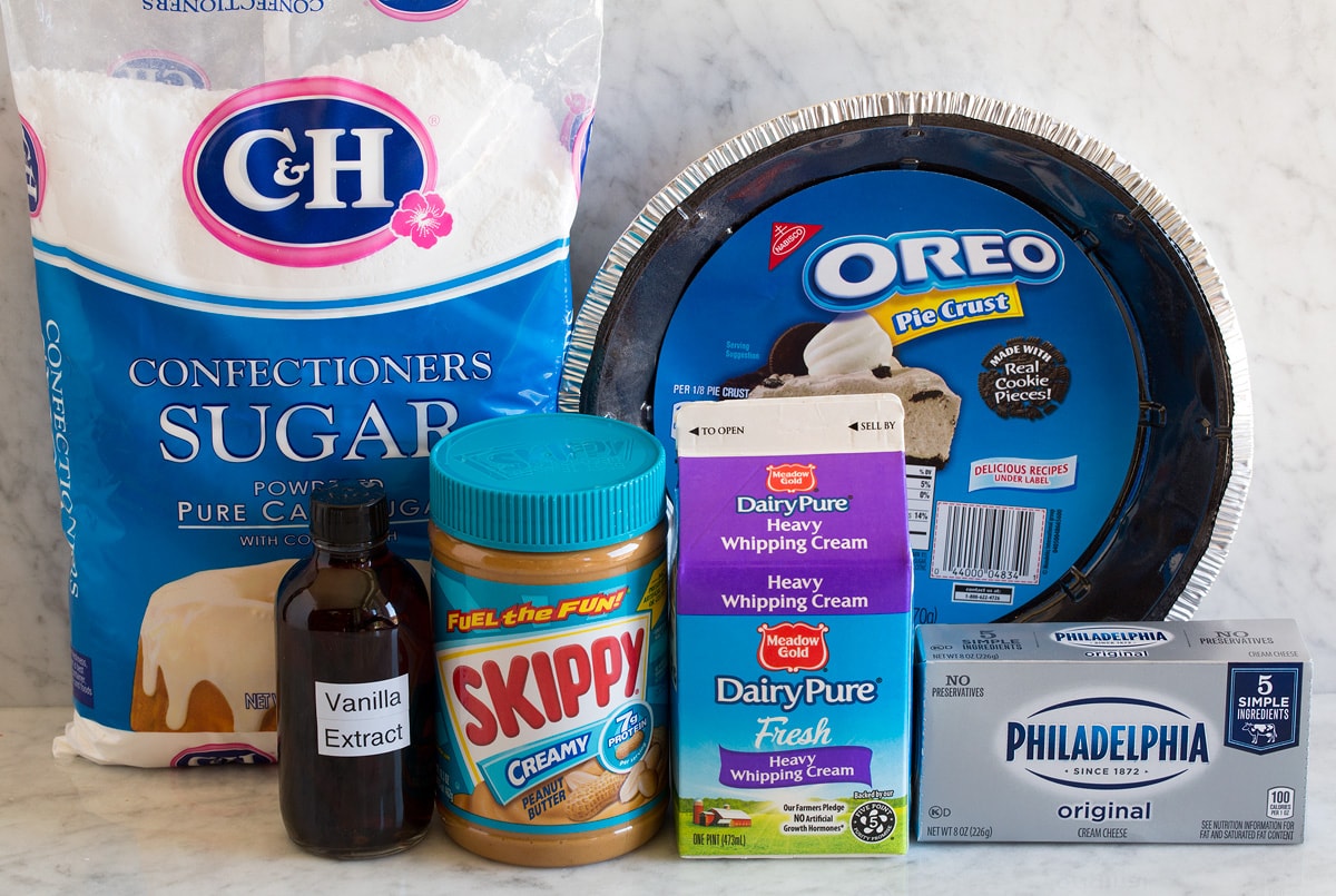 Peanut Butter Pie Image of ingredients used to make peanut butter pie. Includes Oreo crust, peanut butter, powdered sugar, cream cheese, heavy cream and optional vanilla extract.