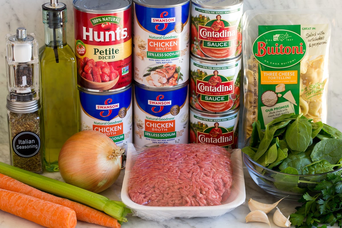 Tortellini Soup Image of ingredients used to make tortellini soup. Includes cheese tortellini, ground beef, tomatoes, tomato sauce, celery, carrots, onion, garlic, spinach, parsley, olive oil, salt and pepper.