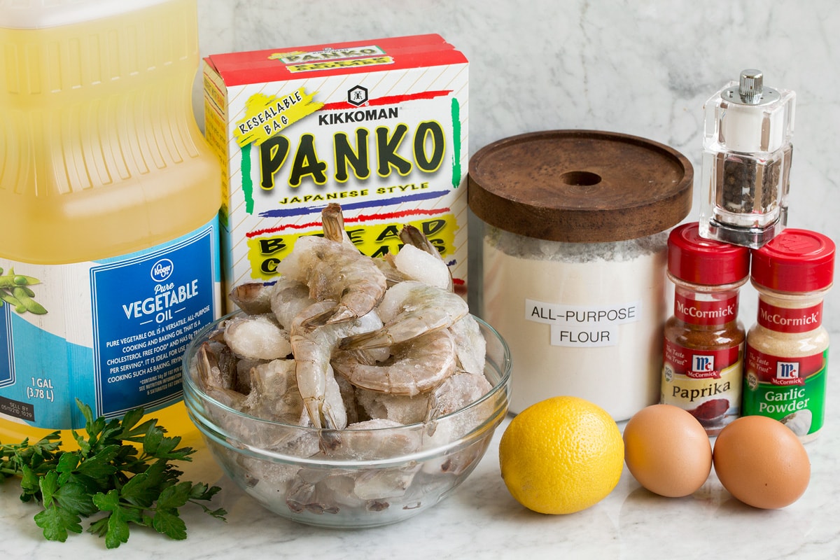 Fried Shrimp Photo of ingredients used to make fries shrimp. Includes shrimp, vegetable oil, panko bread crumbs, flour, eggs, garlic powder, paprika, salt, pepper, parsley and lemon.