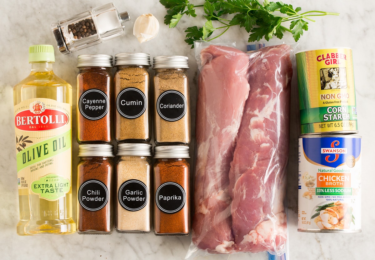 Baked Pork Tenderloin Image of ingredients used to make pork tenderloin. Includes to pork tenderloins, cumin, coriander, paprika, garlic powder, chili powder, cayenne pepper, olive oil, salt and pepper, garlic, parsley, cornstarch and chicken broth.