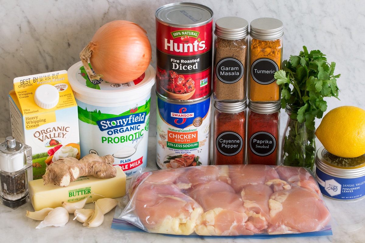 Butter Chicken Photo of ingredients used to make butter chicken. Includes chicken thighs, cream, butter, ginger, garlic, salt and pepper, chicken broth, tomatoes, garam masala, turmeric, smoked paprika, cayenne pepper, cilantro, lemon and fenugreek.