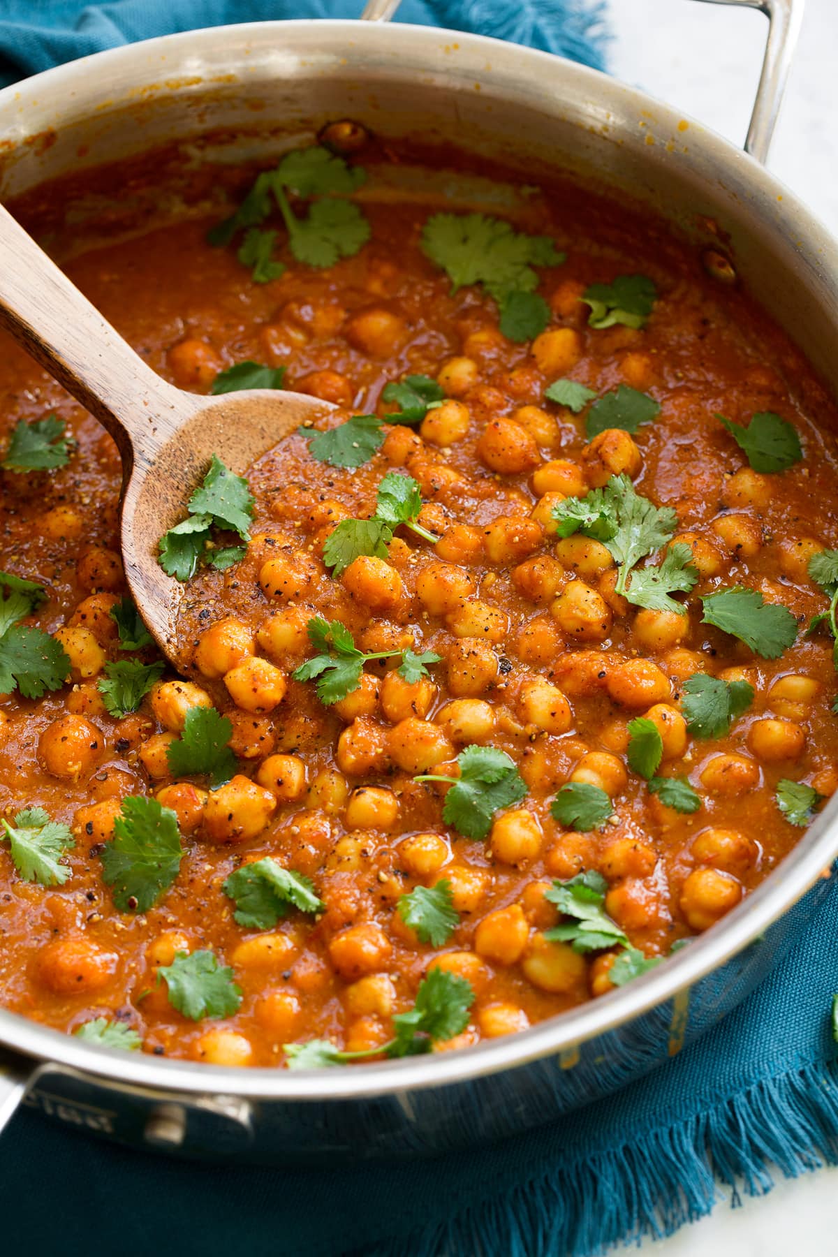 Chickpea Curry Chickpea curry in a saute pan shown from a side angle.