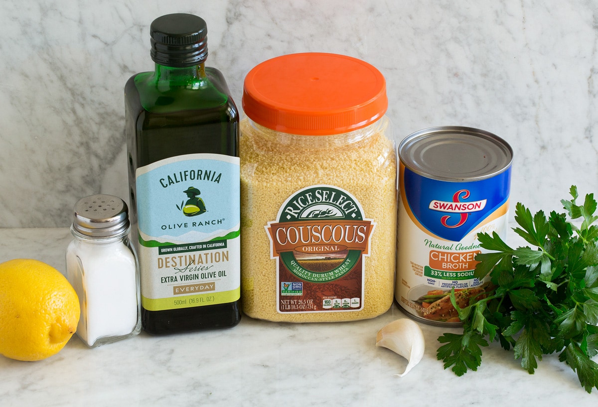 Lemon Couscous Photo of ingredients used in lemon couscous. Includes moroccan couscous, olive oil, garlic, parsley, chicken broth, lemon, salt.