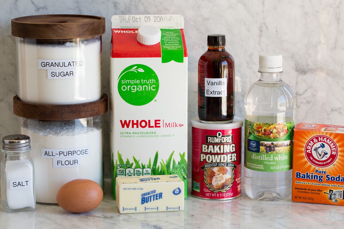 Homemade Pancakes Photo of ingredients for pancakes. Includes milk, flour, sugar, baking soda, baking powder, vinegar, vanilla, sugar, egg and butter.
