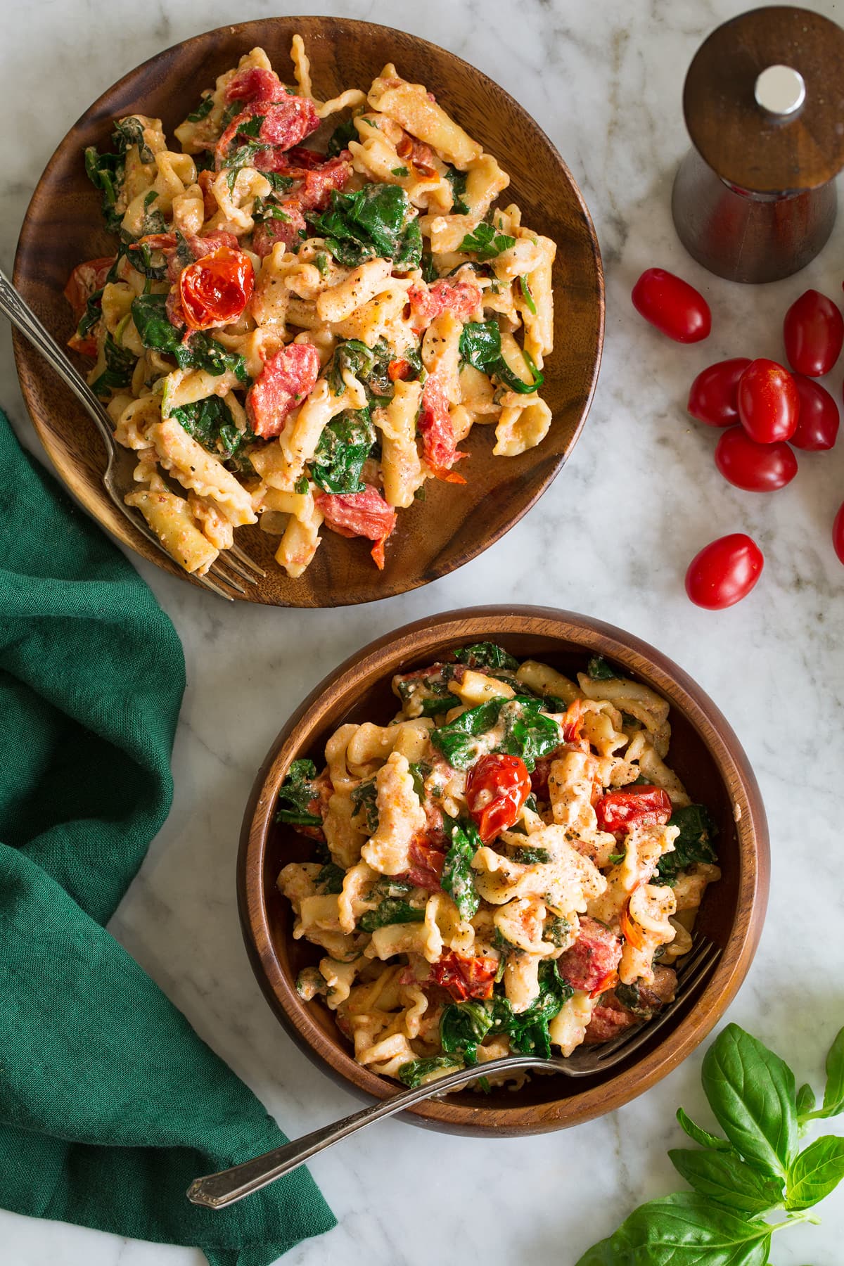 Baked Feta Pasta Photo: Two servings of tiktok baked feta pasta shown from above on a white marble surface.
