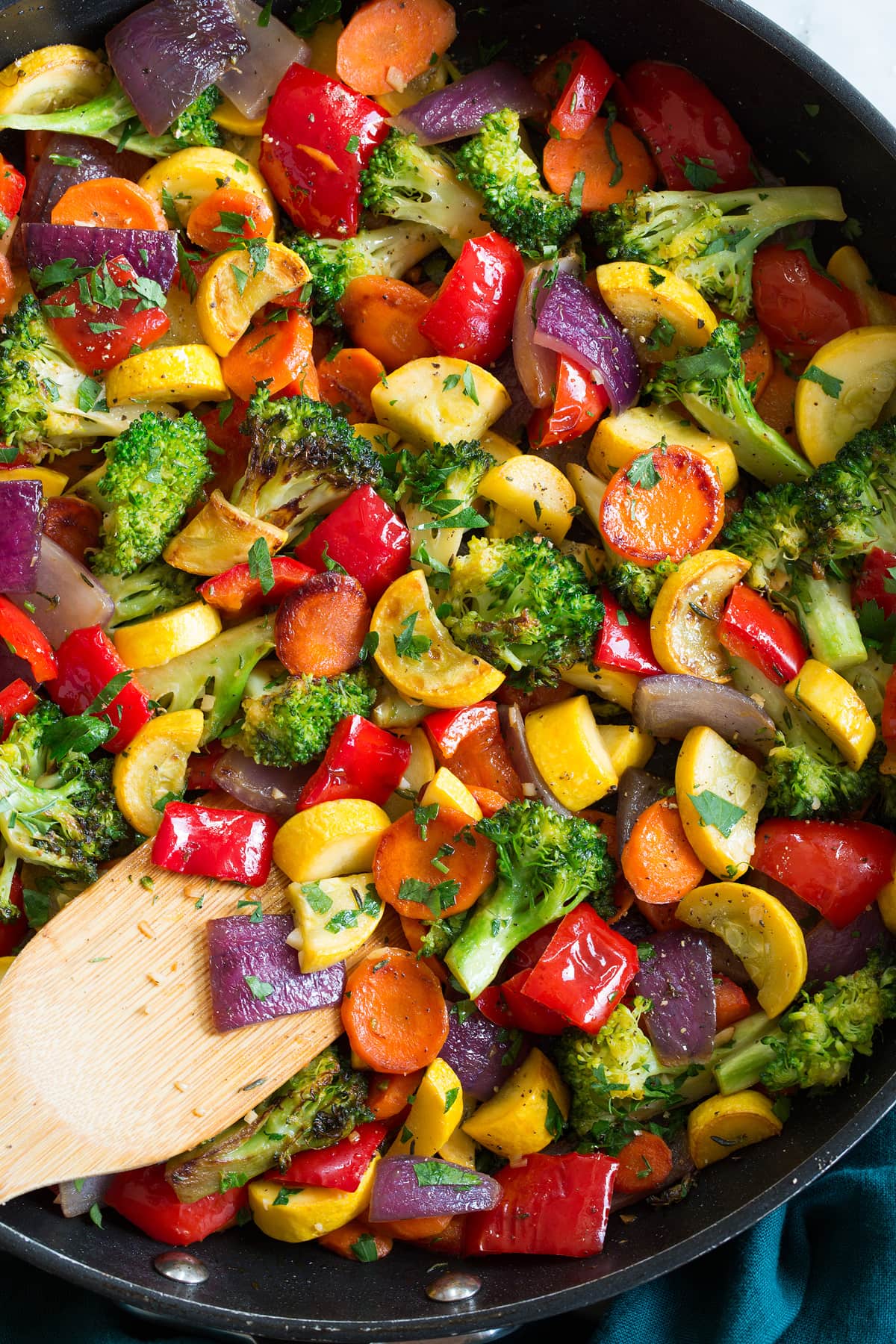 Sautéed Vegetables Close up photo of chopped sauteed vegetables in a pan.