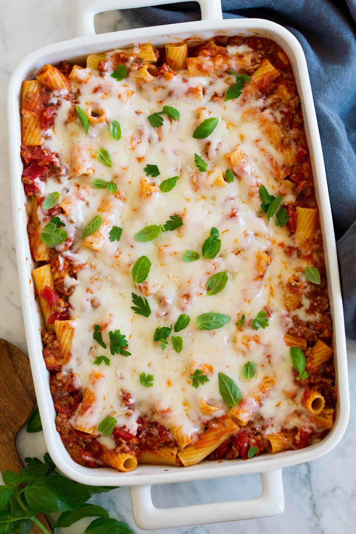 Baked Rigatoni Baked rigatoni shown in a white rectangular ceramic baking dish from above.