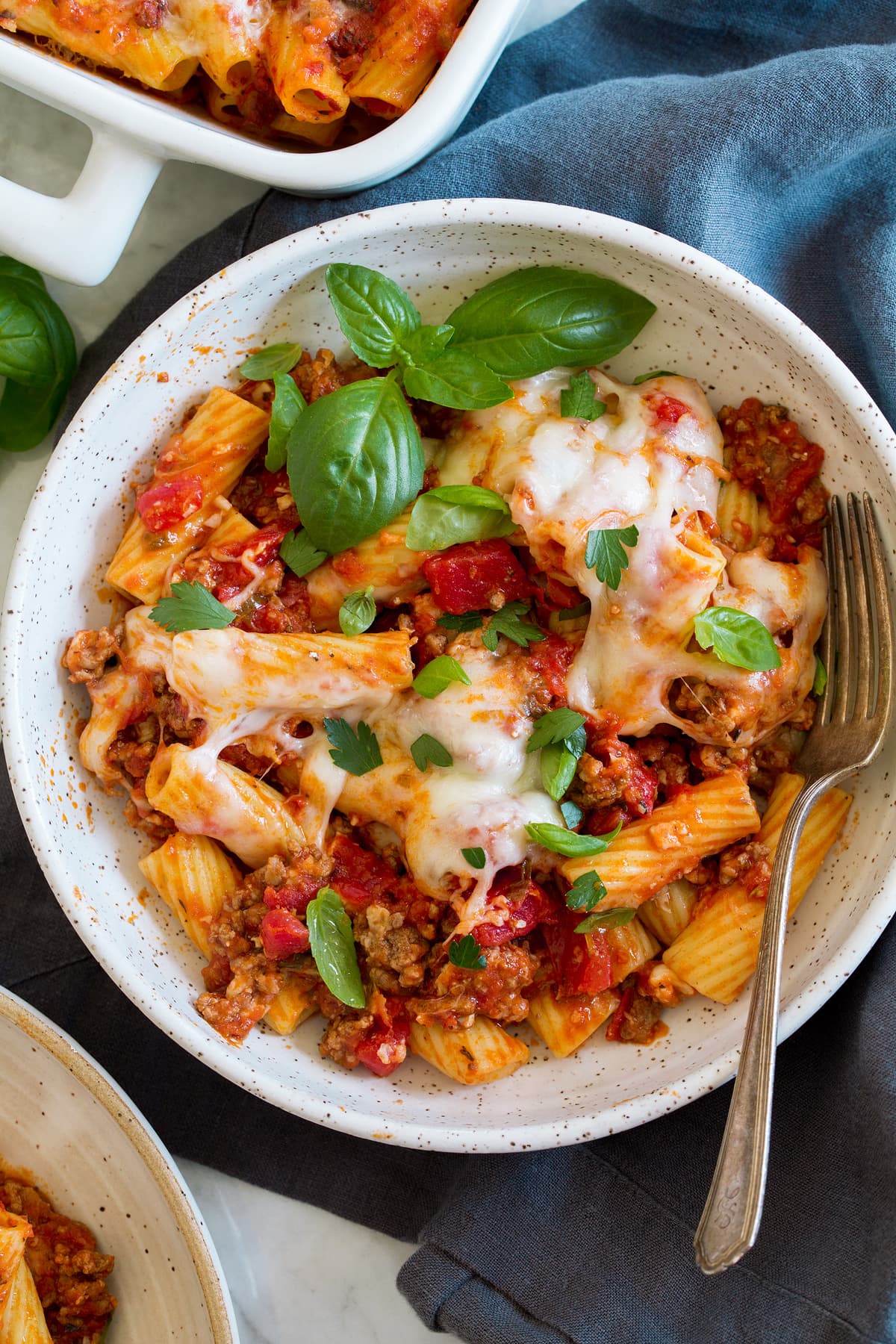 Baked Rigatoni Overhead photo of a serving of baked rigatoni shown in a pasta bowl with a fork.