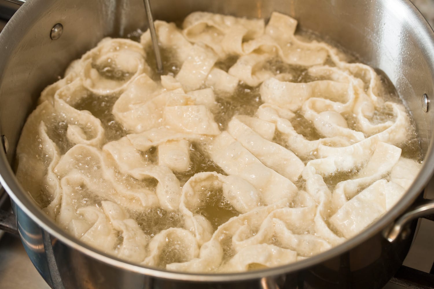 Fried Wonton Strips Deep frying wonton strips.