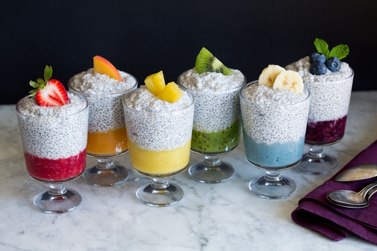 Chia Seed Pudding Six jars of chia pudding layered with fruit puree and topped with fresh fruit.