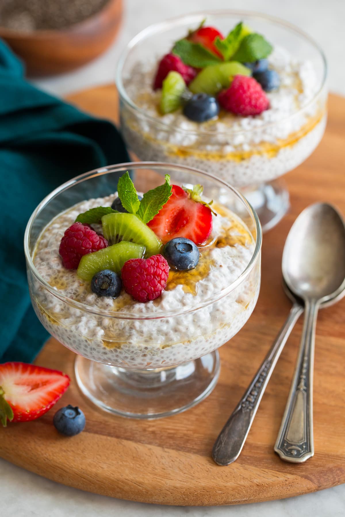 Chia Seed Pudding Two servings of chia seed pudding topped with diced fruit.
