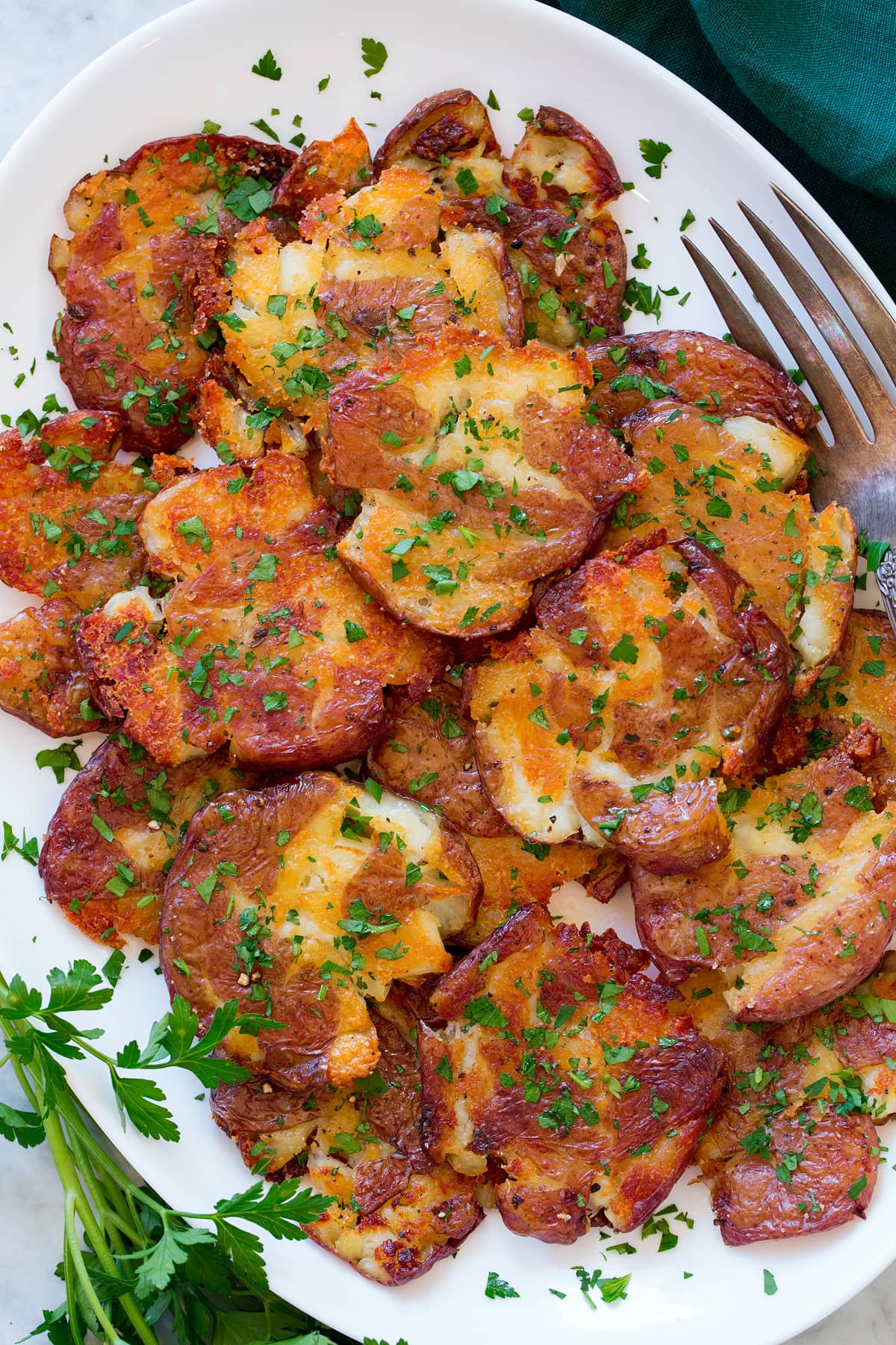 Smashed Potatoes Close up photo showing crispy texture of smashed potatoes.