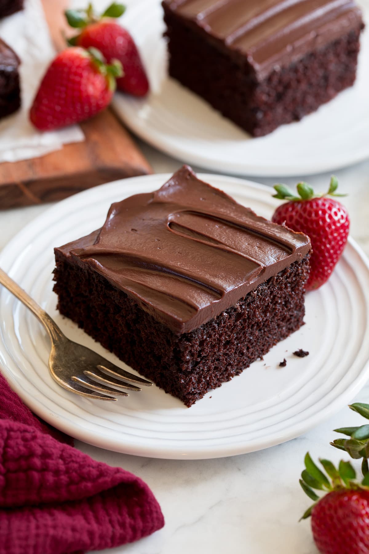 Chocolate Cake Slice of easy to make chocolate cake covered with a chocolate ganache frosting.