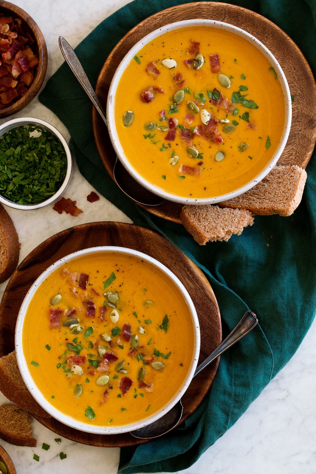 Pumpkin Soup Two servings of pumpkin soup shown from overhead.