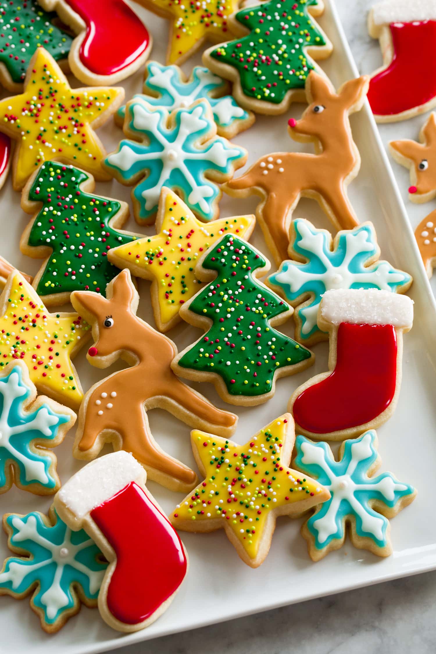 Cutout Sugar Cookies Iced sugar cookies on a rectangular white tray.