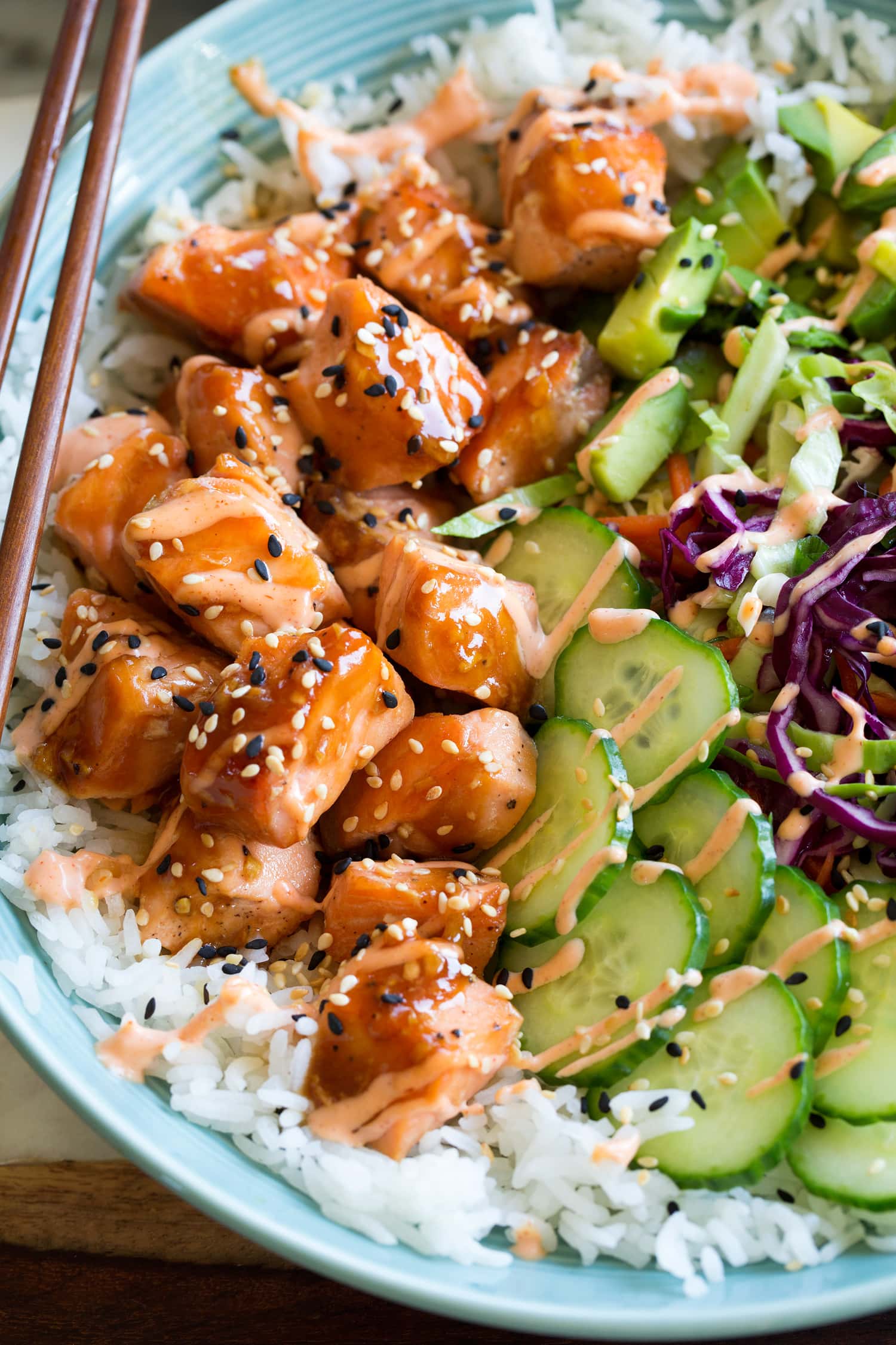 Salmon Rice Bowls Close up photo of glazed salmon, veggies and white rice.