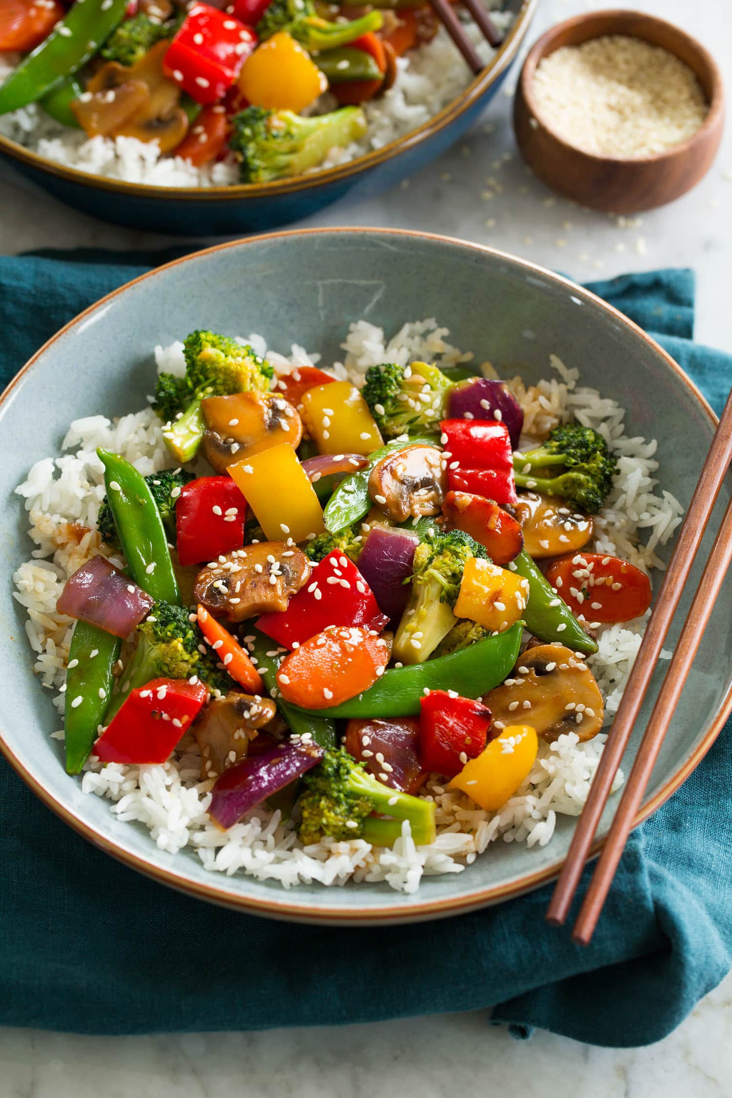 Vegetable Stir Fry Vegetable stir fry with bell peppers, carrots, peas, broccoli, red onion, and mushrooms.