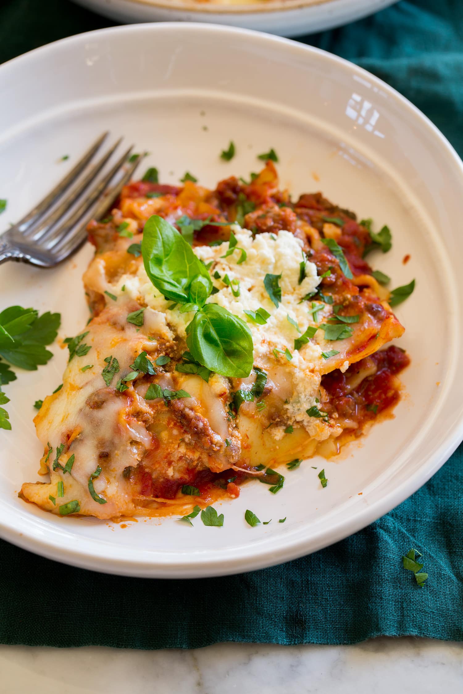 Skillet Lasagna Slice of skillet lasagna in a white pasta bowl.