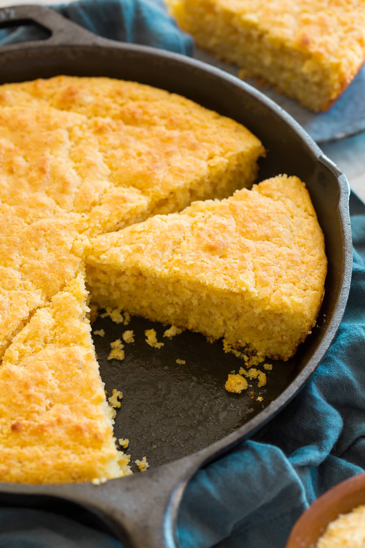 Southern Skillet Cornbread Cornbread sliced in a cast iron skilelt.