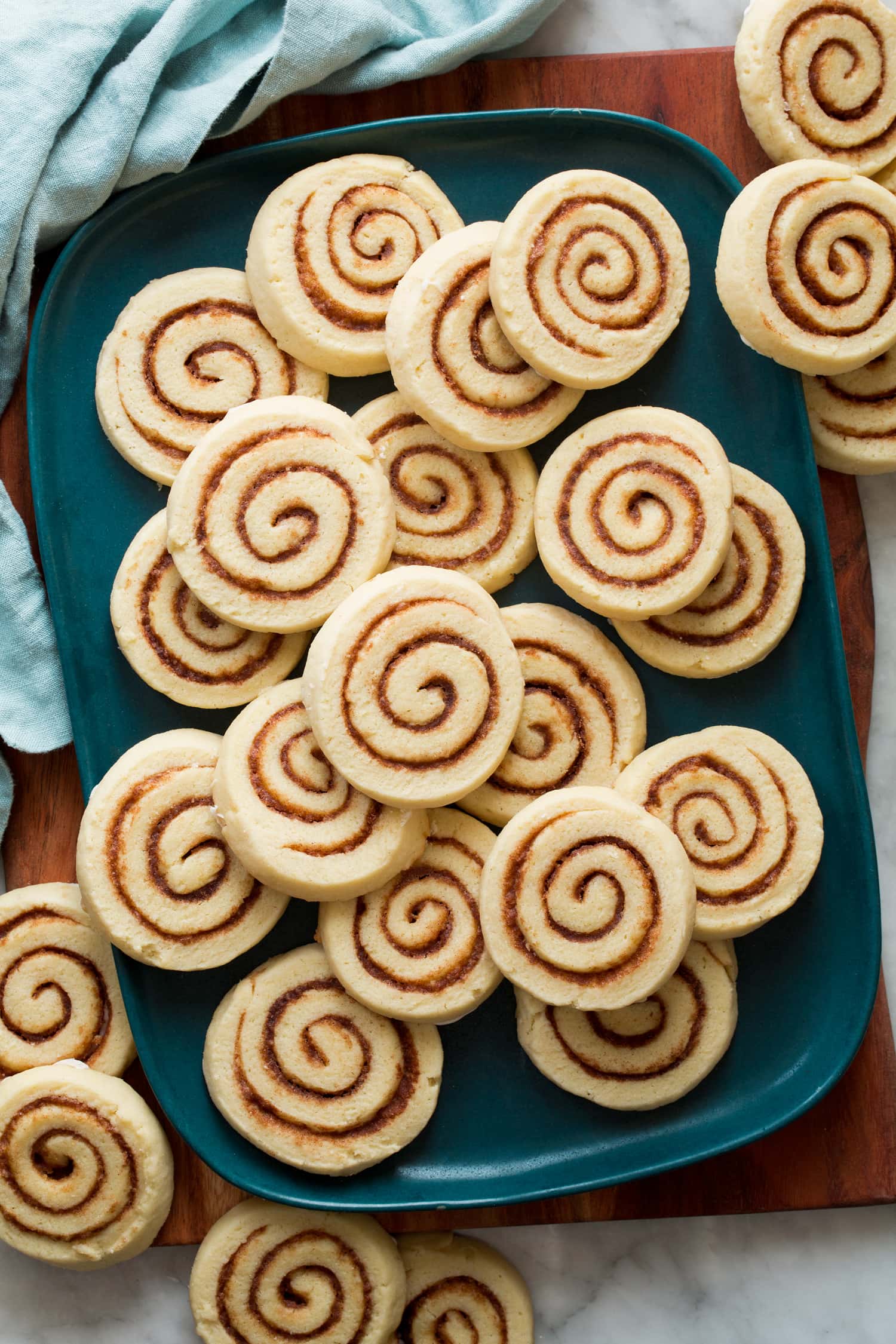 Cinnamon Roll Cookies Sliced soft cream cheese cinnamon roll cookies showing pretty cinnamon sugar swirl.